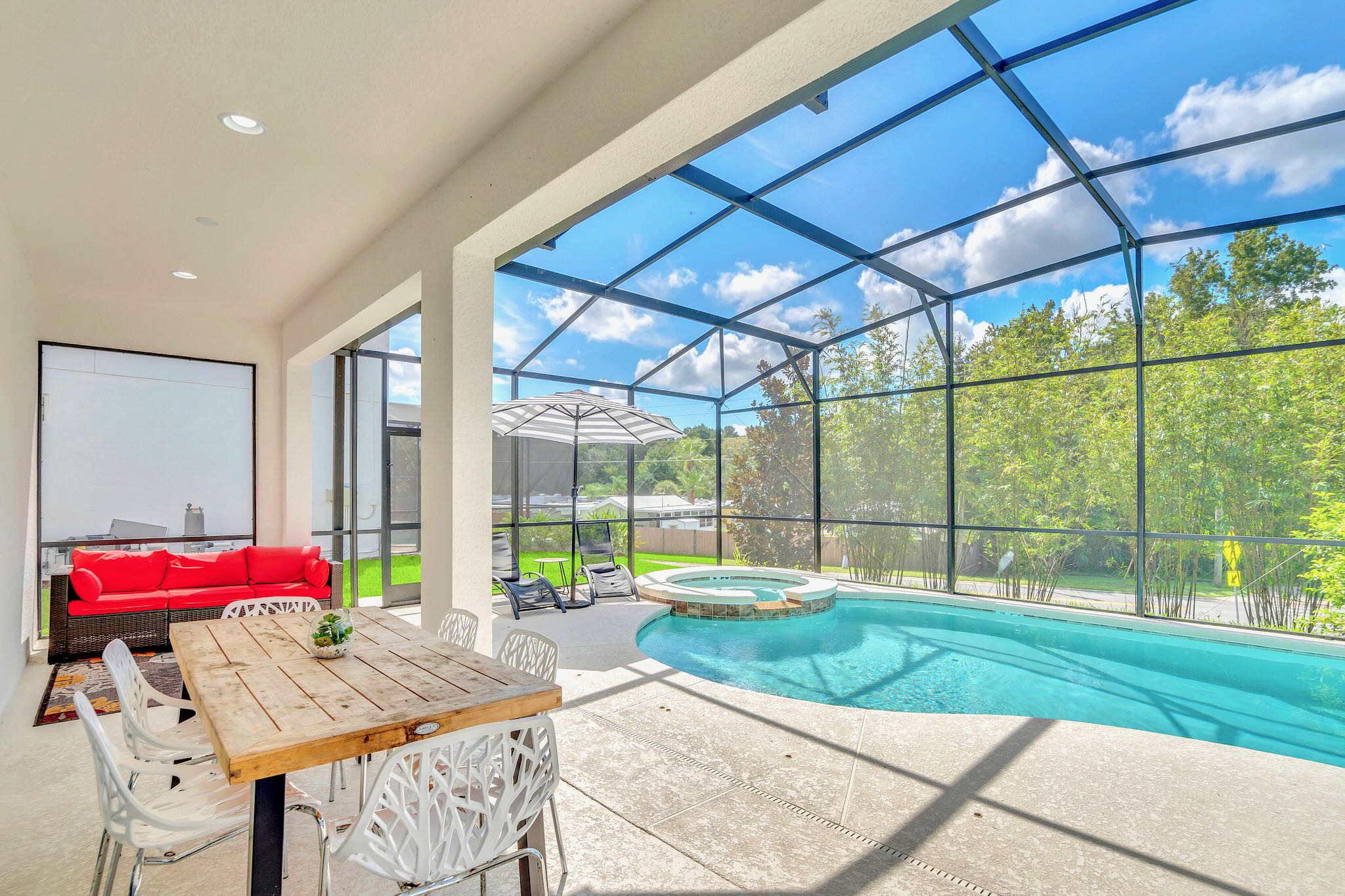 Dine Poolside In This Covered Patio Featuring A Stunning Pool View