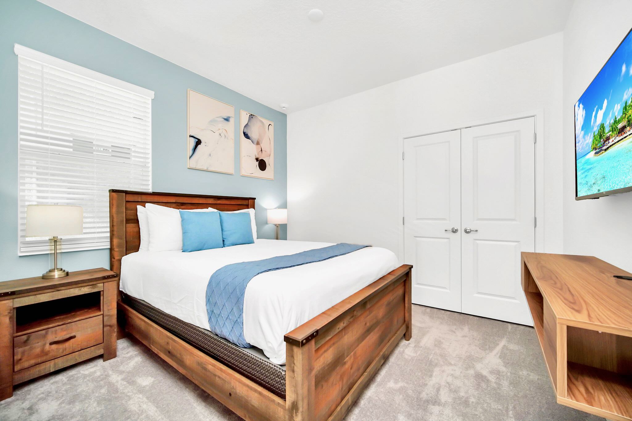 Elegant King Room Featuring A Smart TV And Stylish Modern Decor