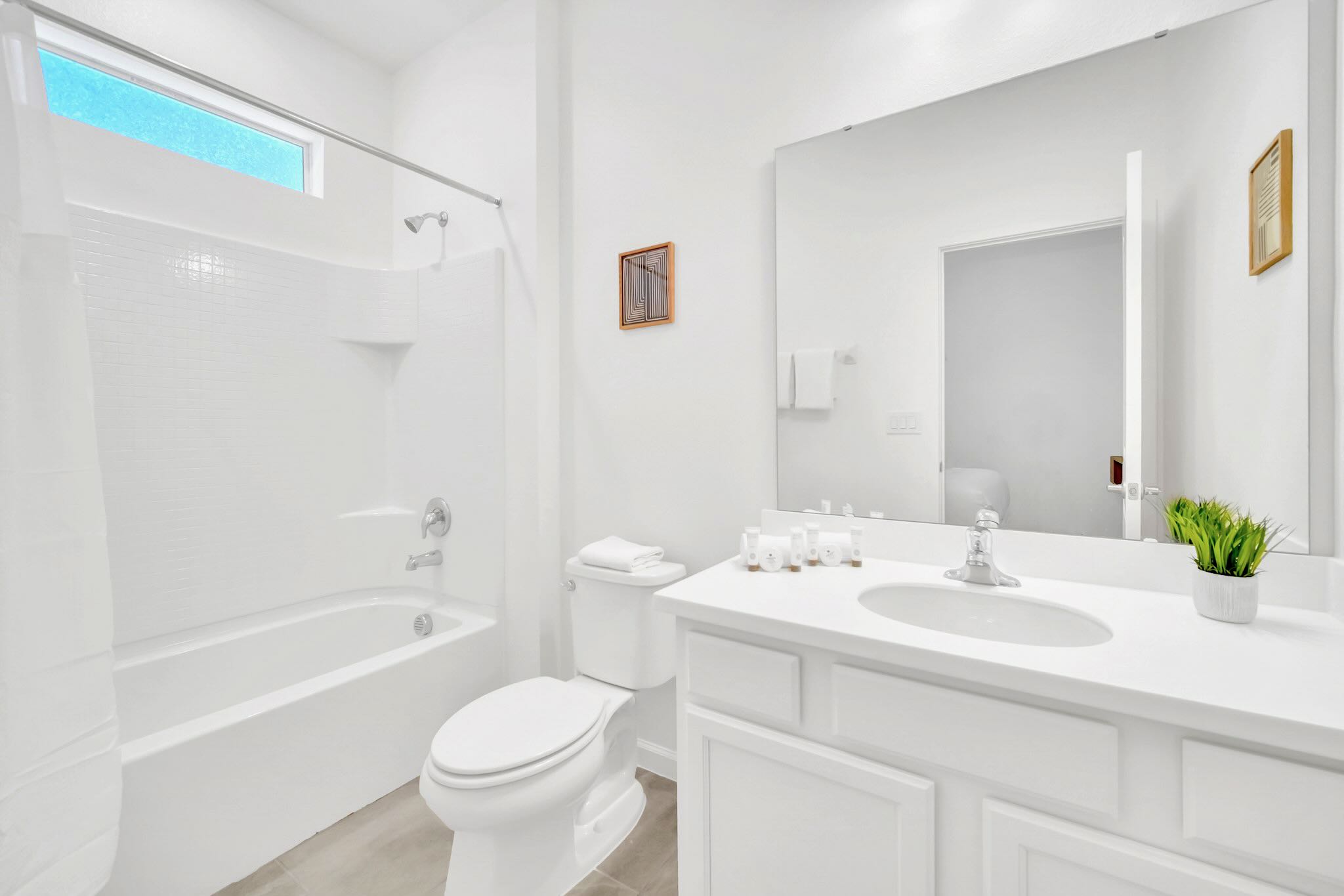 Modern Bathroom With Sleek Fixtures And Ample Counter Space