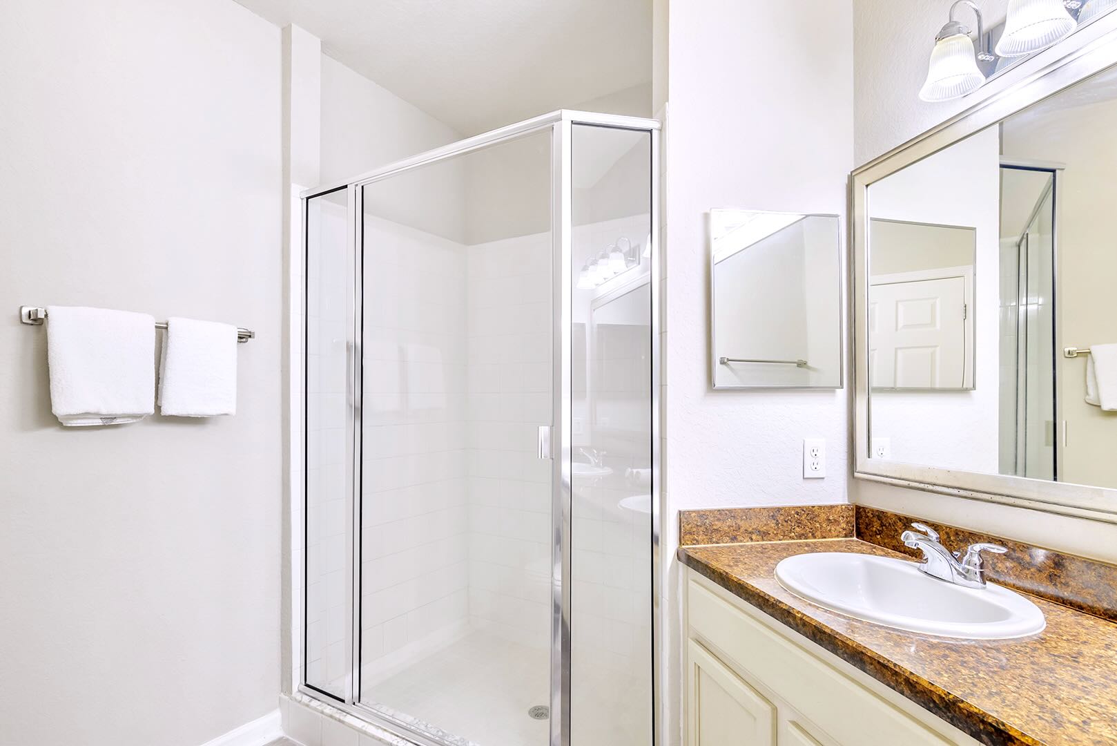 Modern Ensuite Bathroom With A Spacious Walk-In Shower And Elegant Design
