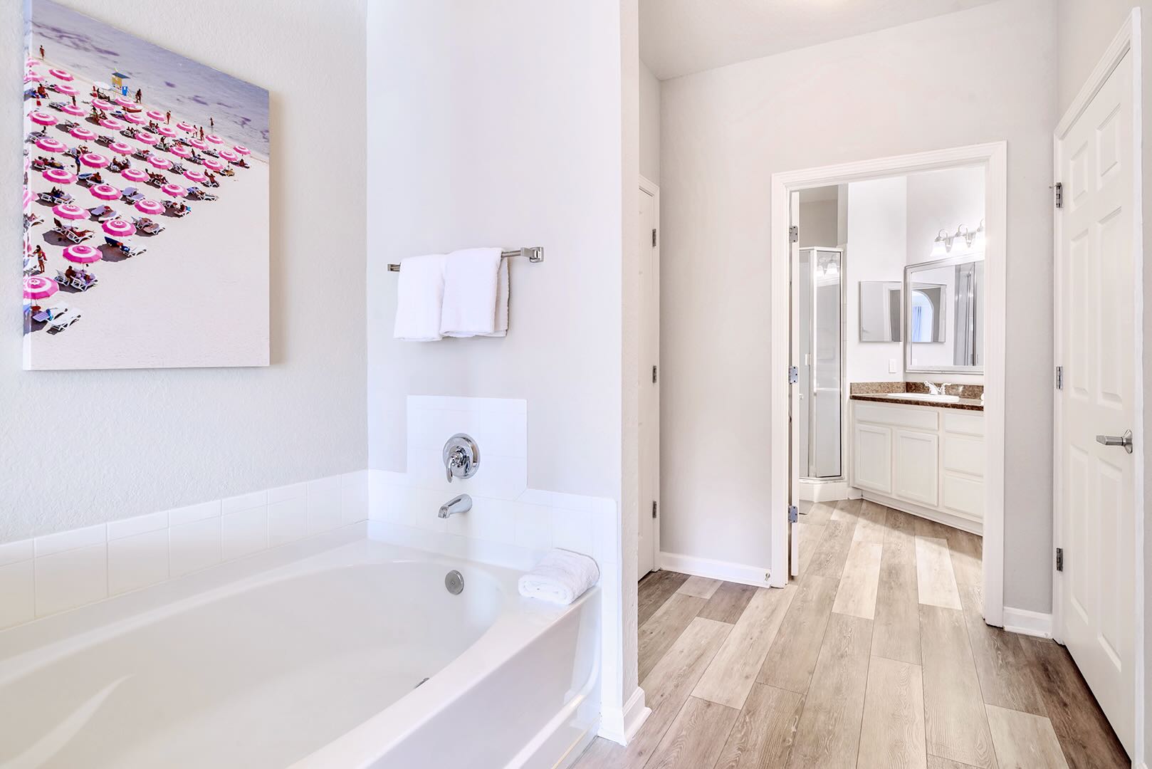 Elegant Ensuite Bathroom Featuring A Soaker Tub And Sleek Design