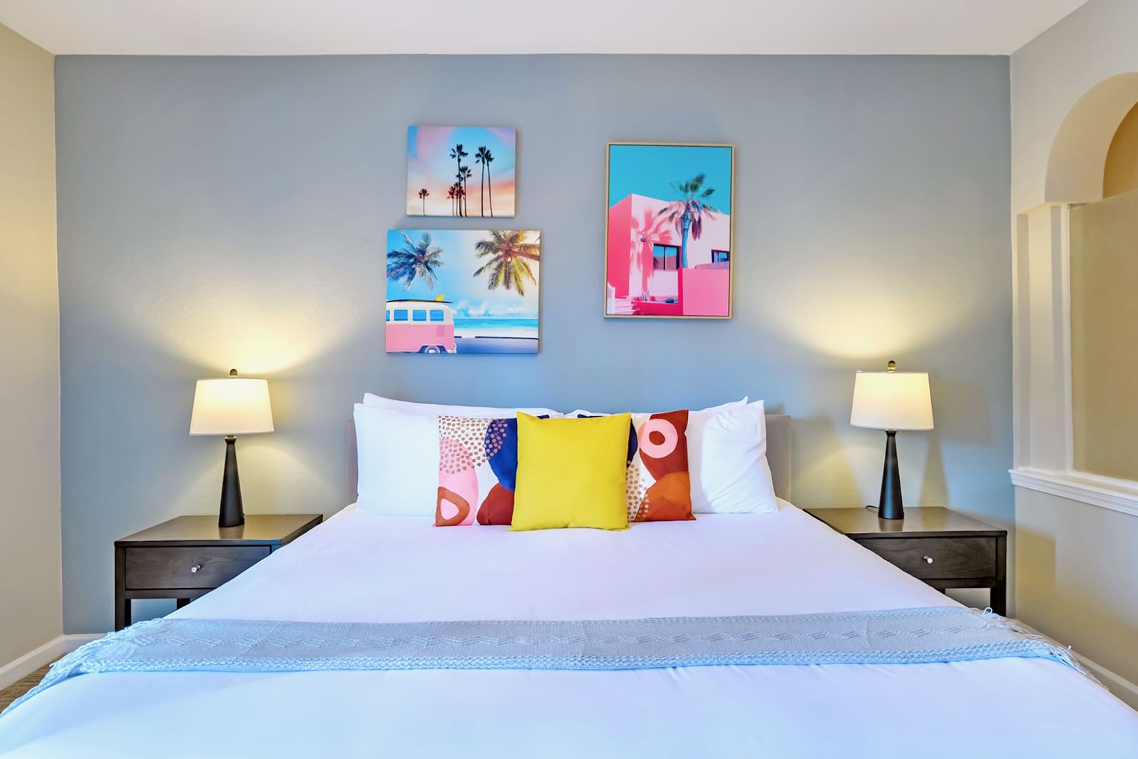 Inviting Master Bedroom With Colorful Decor And Ample Natural Light