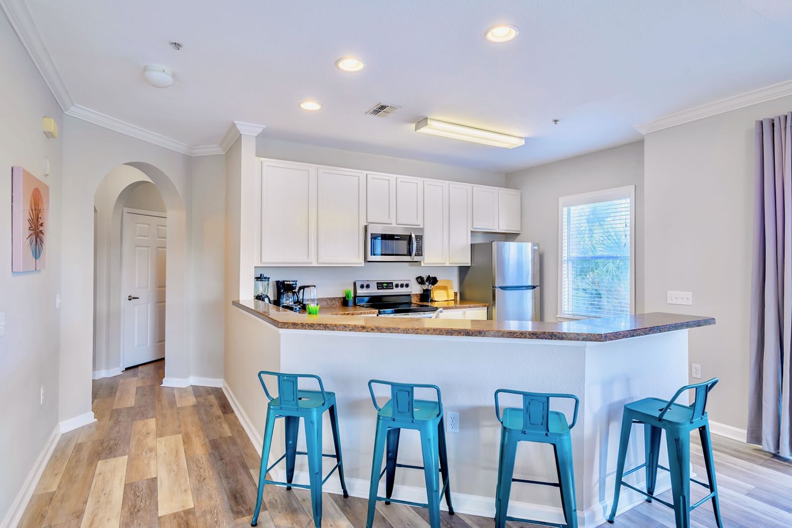 Elegant Kitchen Featuring Granite Countertops And Modern Cabinetry
