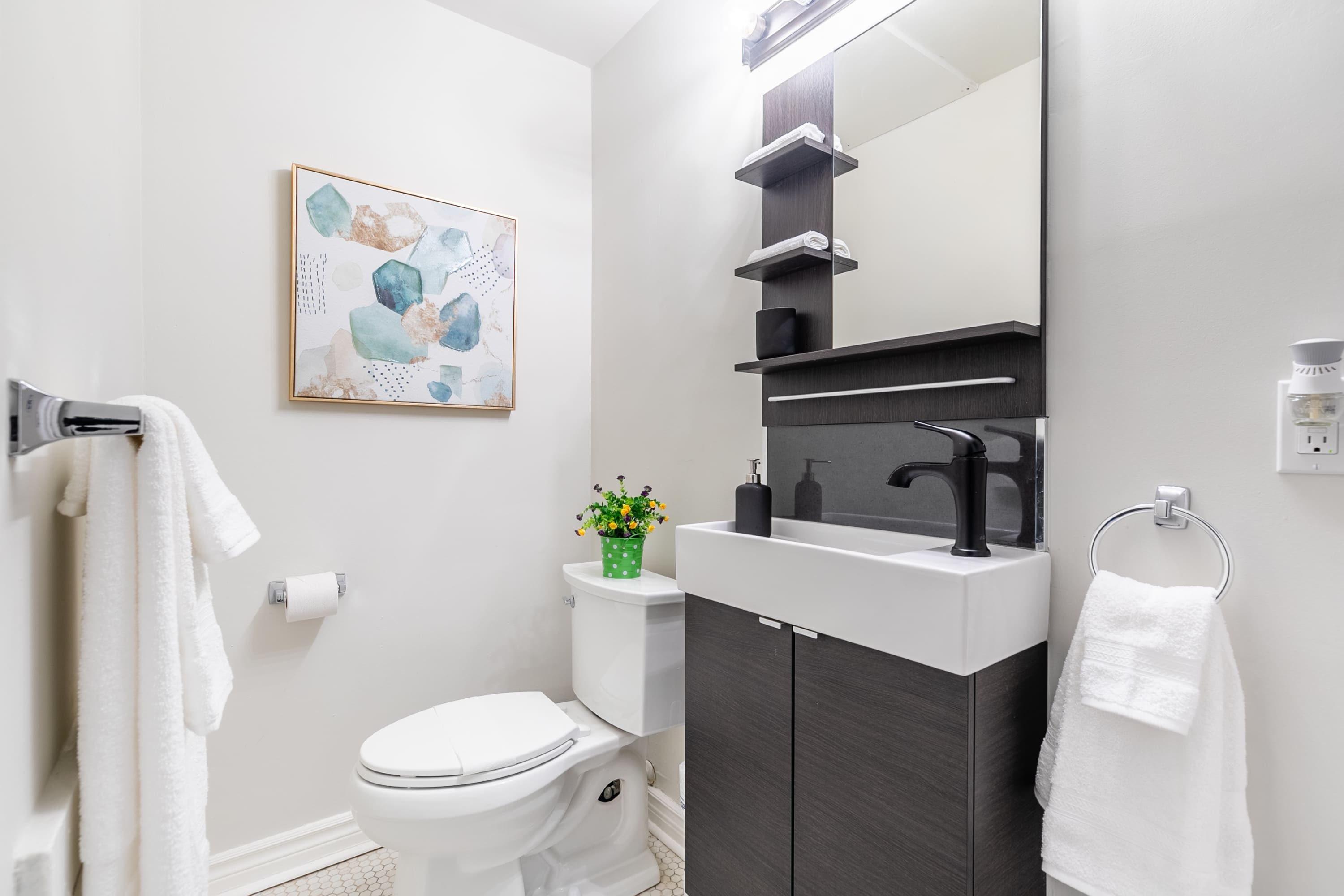 Modern Compact And Modern Bathroom With Clean Design, Featuring A Spacious ShowerBathroom With Stylish Sink, Black Accents, And Clean Design