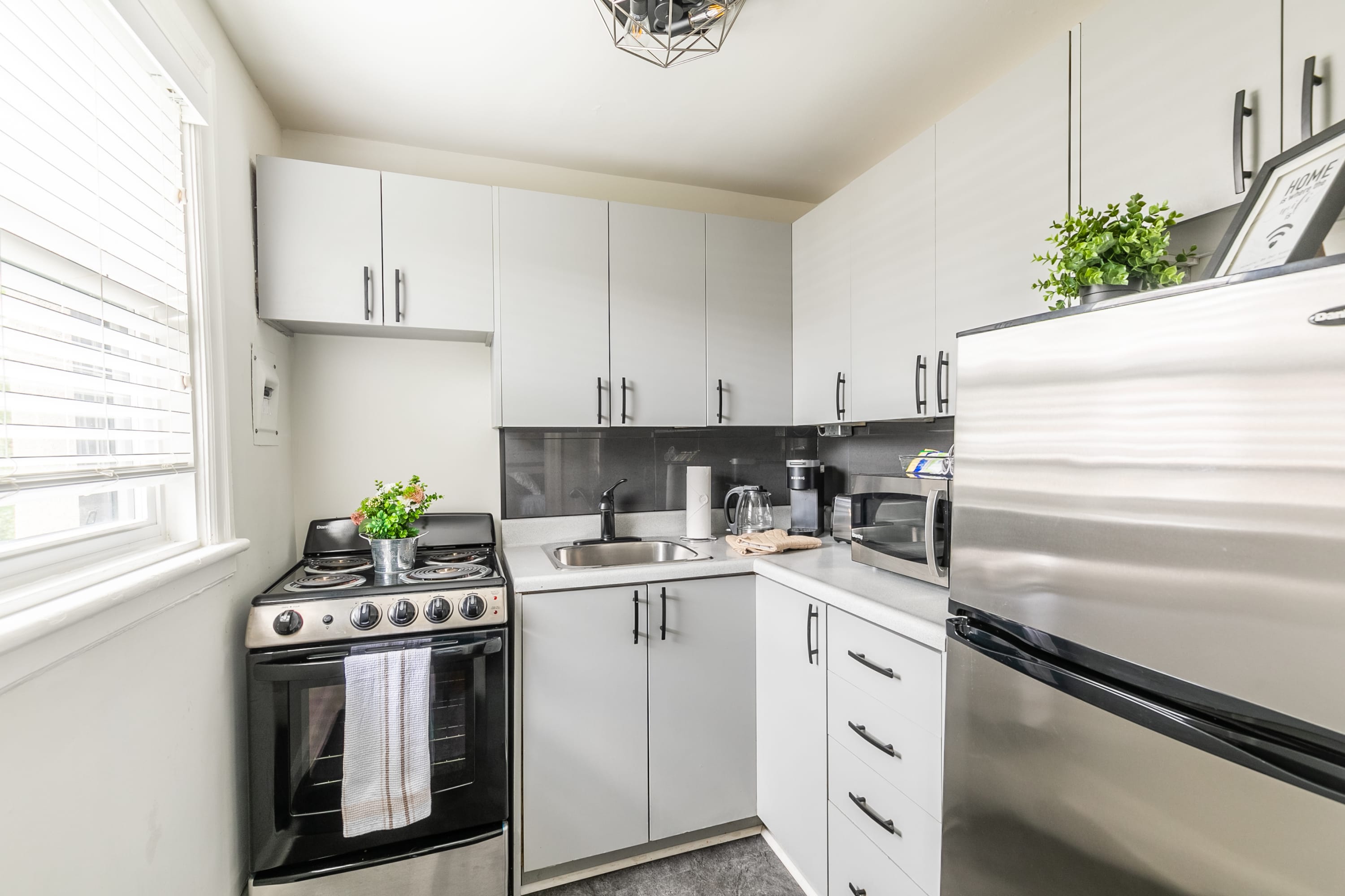 Fully Equipped Kitchen With Spacious Countertops And Modern Appliances