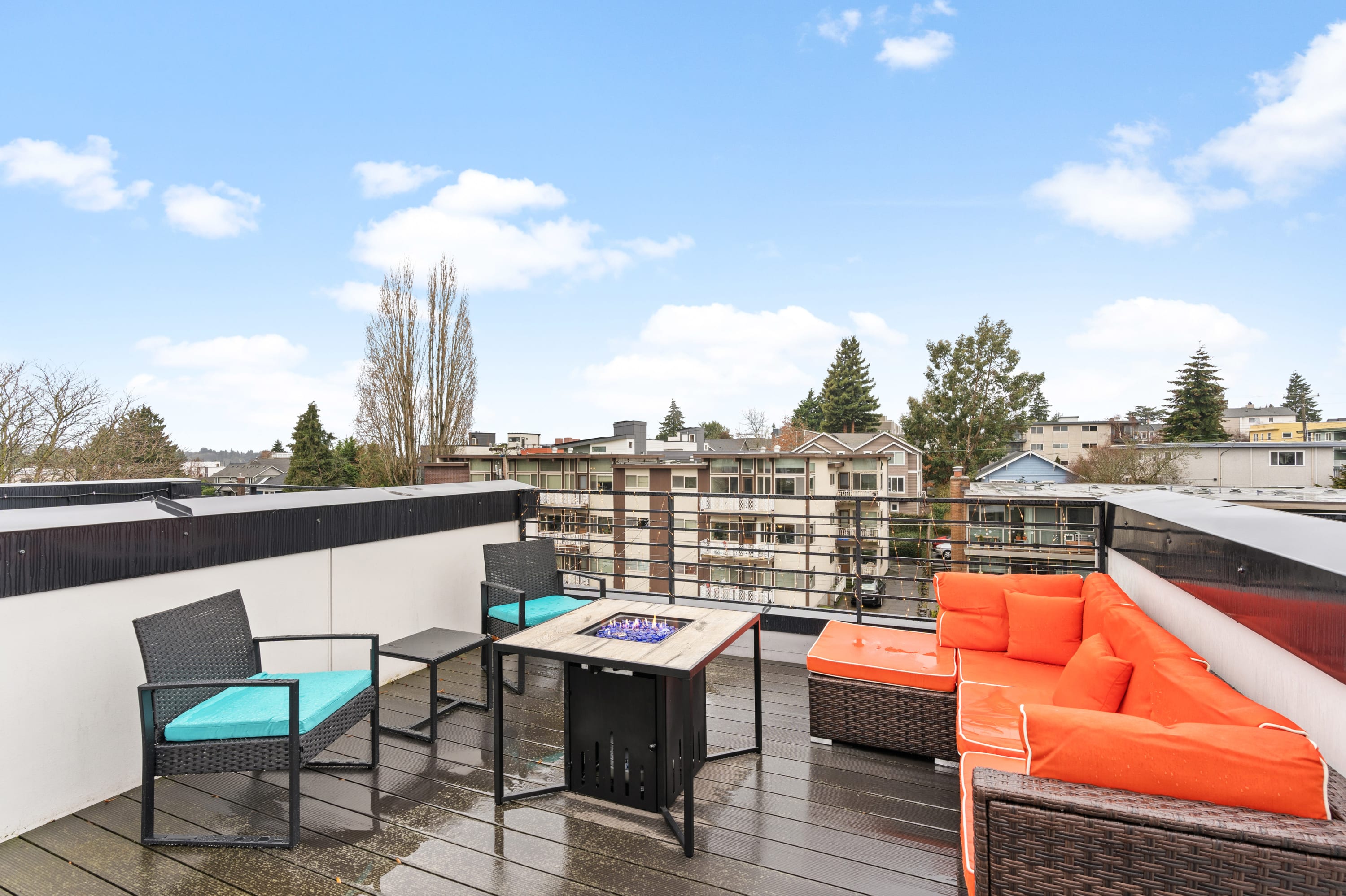 Fire pit and comfy furniture on the rooftop.