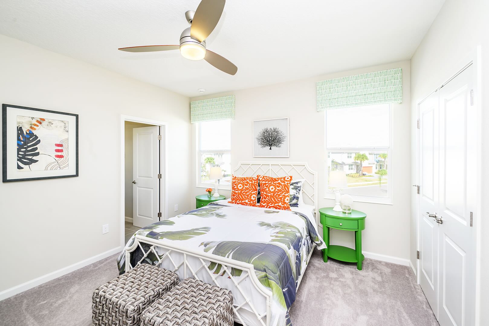 Bright Bedroom With Vibrant Green Accents And Large Windows