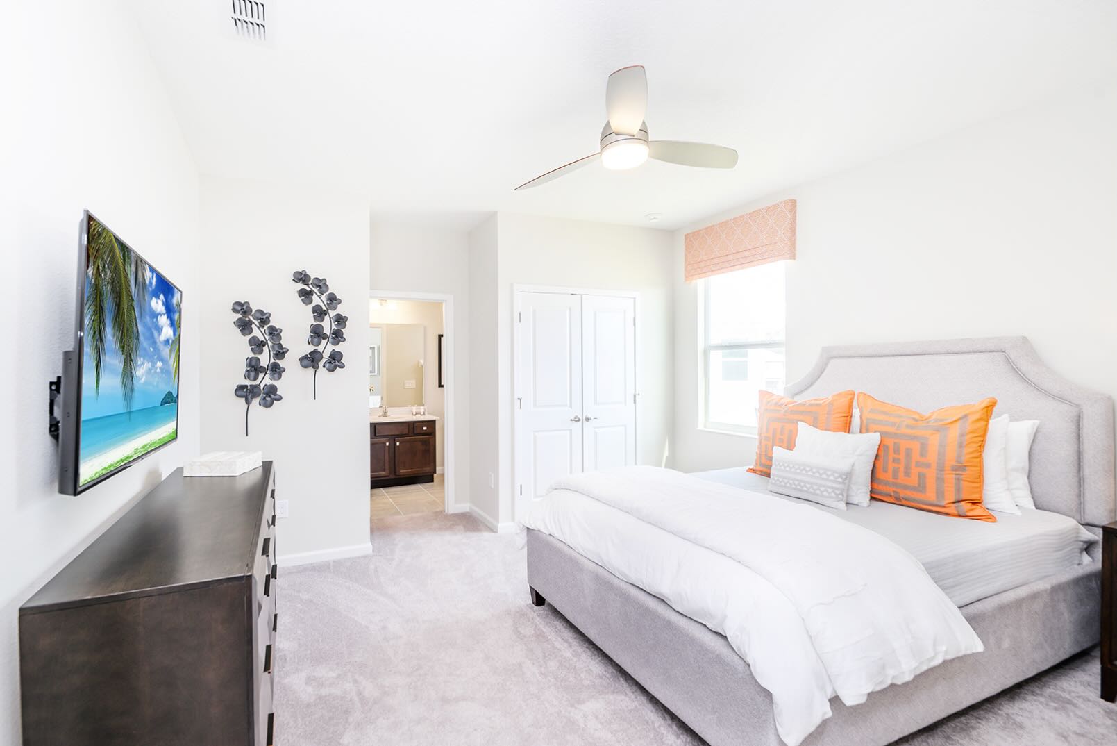 Airy Bedroom With Large Window And Bold Decorative Pieces