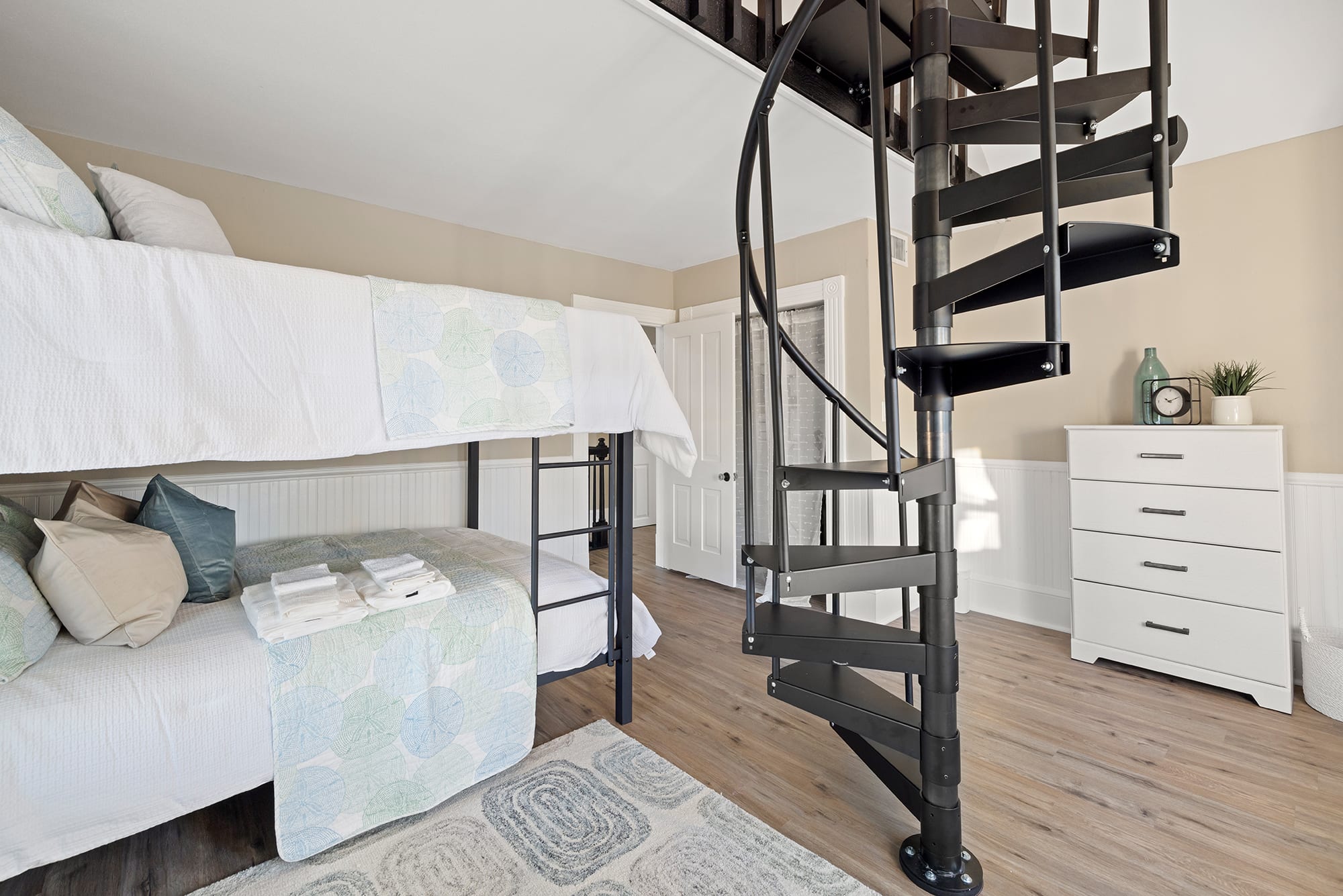 Full/Full bunk bed with spiral staircase to a loft with two twin beds!