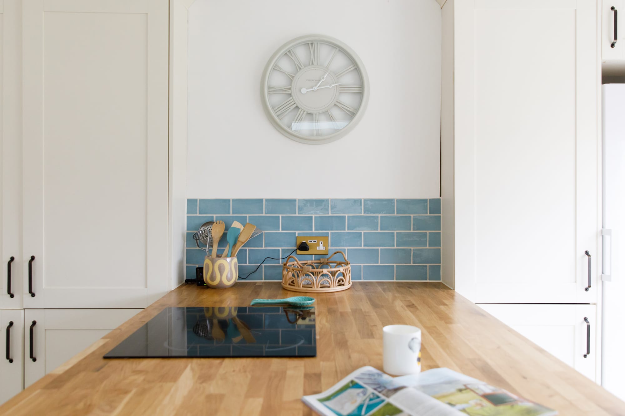 The island has an induction hob and breakfast bar.