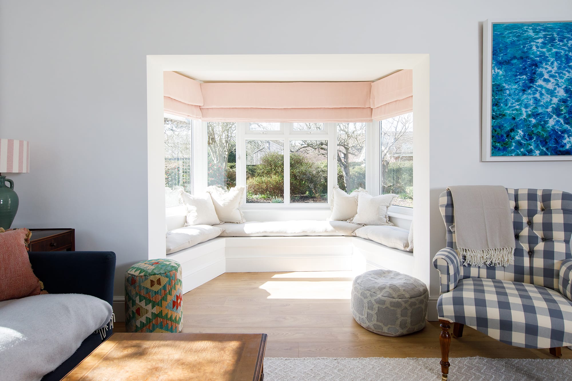 The lounge has a beautiful sunny window seat. The perfect spot to read a book or catch the morning sunshine with a cuppa.