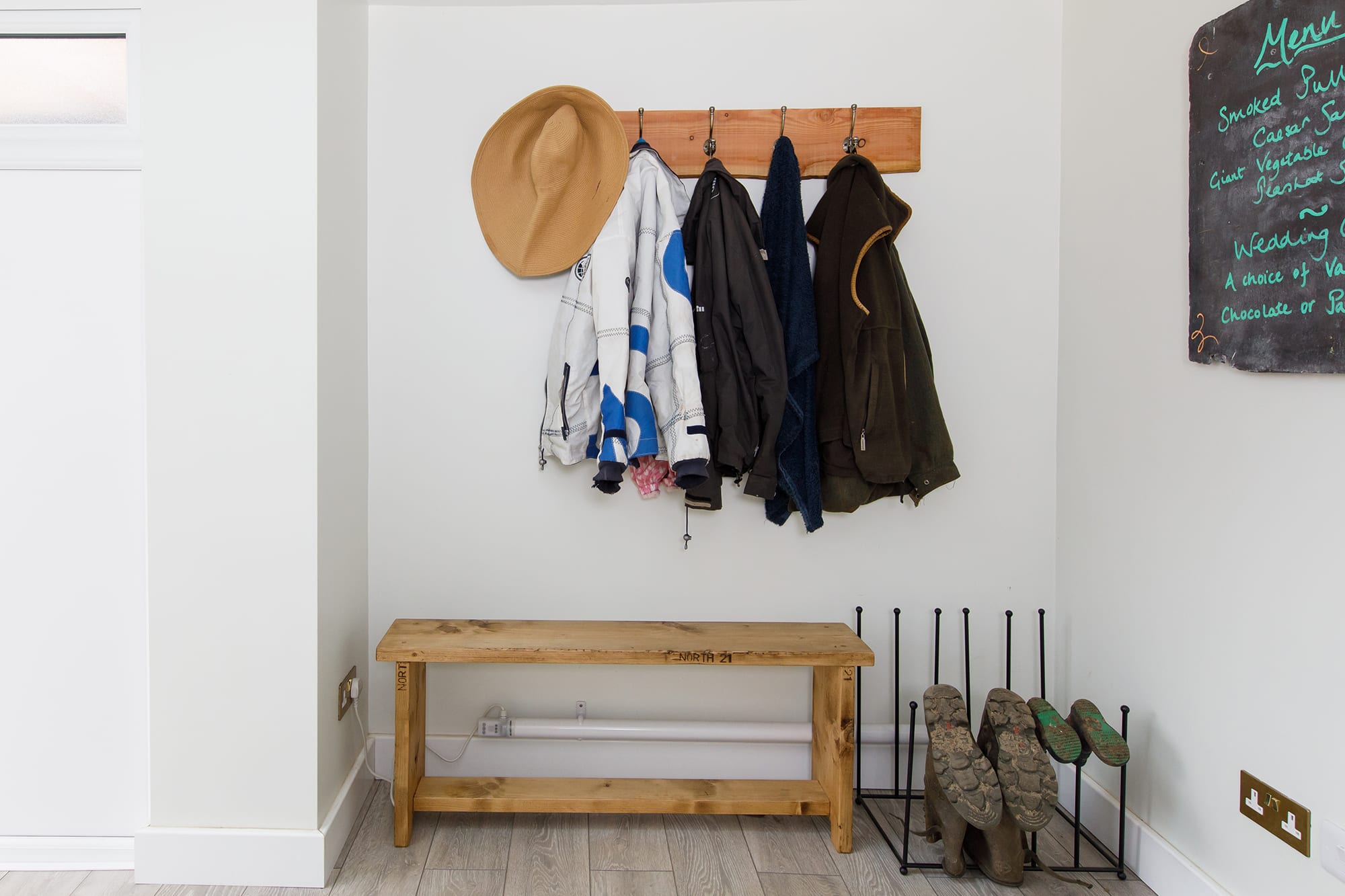 The entrance hall has plenty of space for shoes, boots and coats.