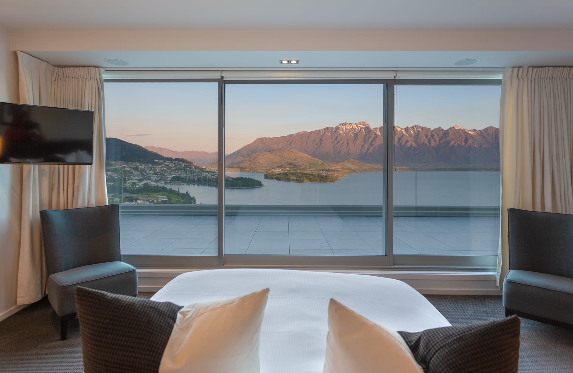 Relax and admire the mountains from your bed