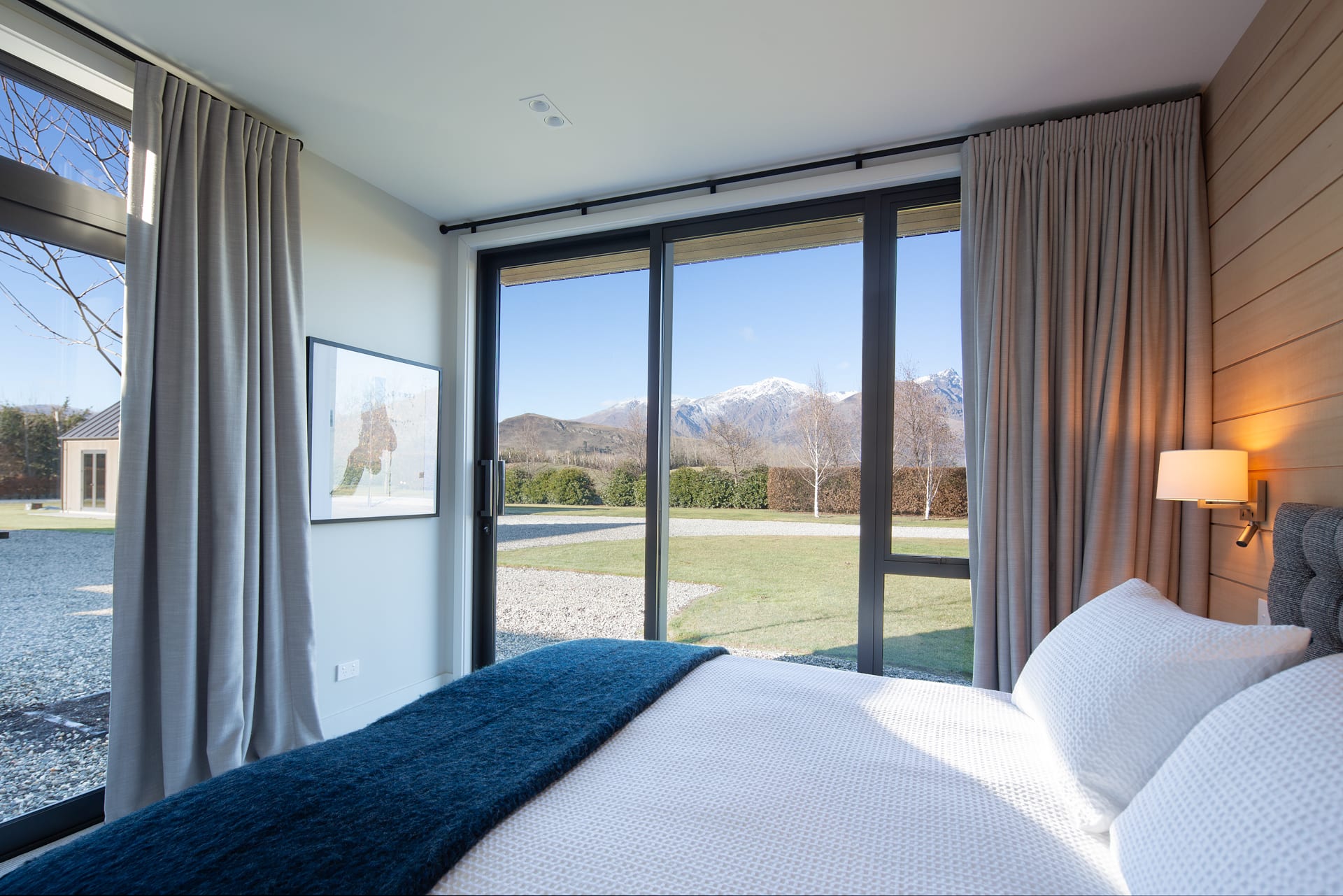 Bedroom 2 with views over the lawn and mountains