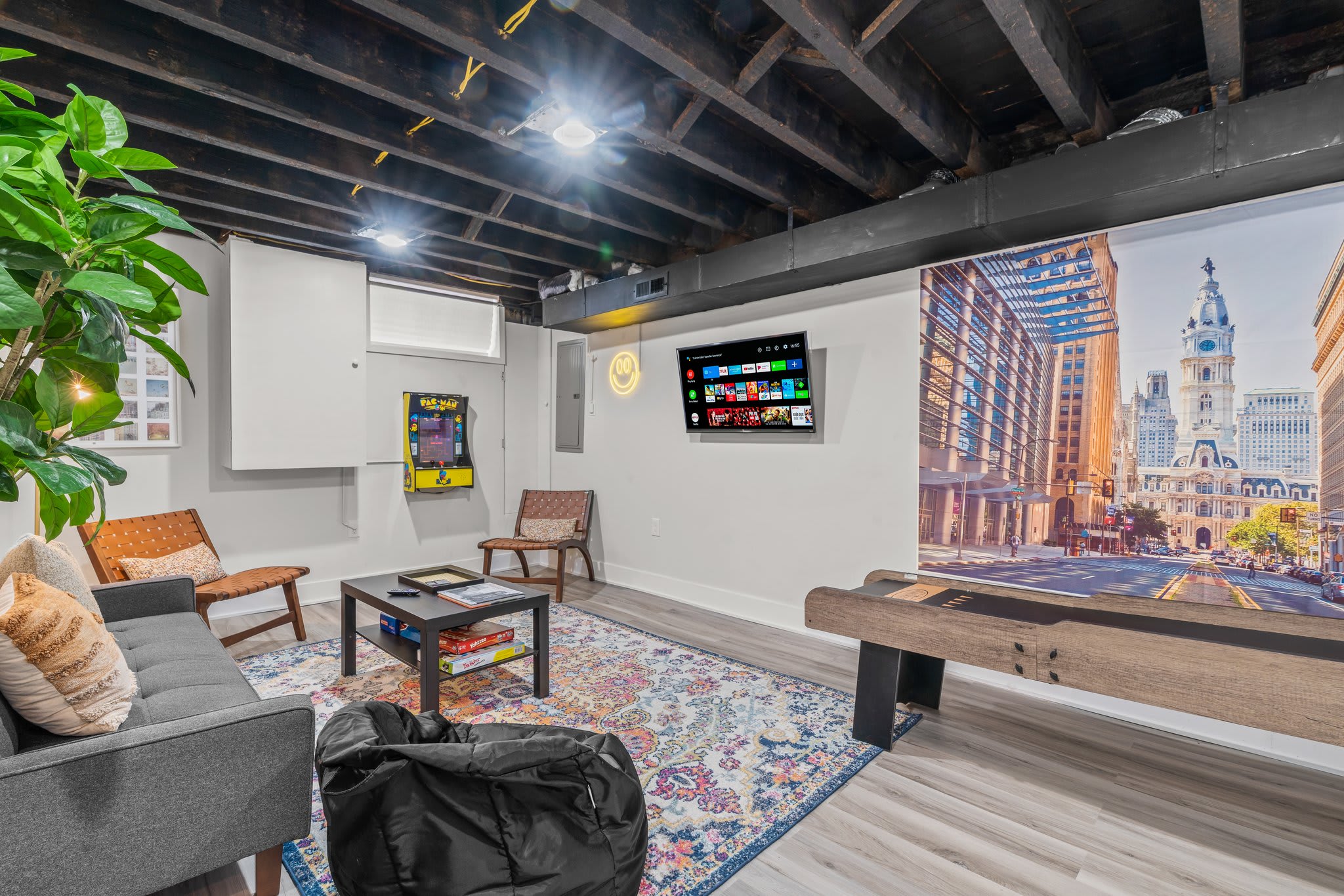 The basement offers a fun-filled game area with shuffleboard and arcade games, providing endless entertainment. You’ll enjoy hours of laughter and bonding.