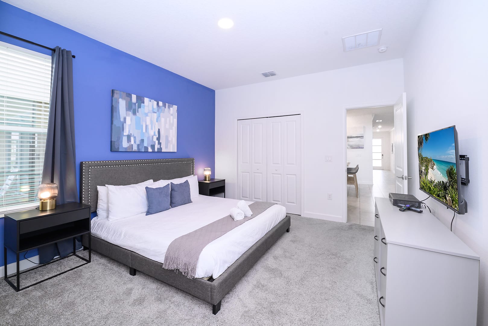 King Bedroom With Soft Blue Tones And Sophisticated Furnishings