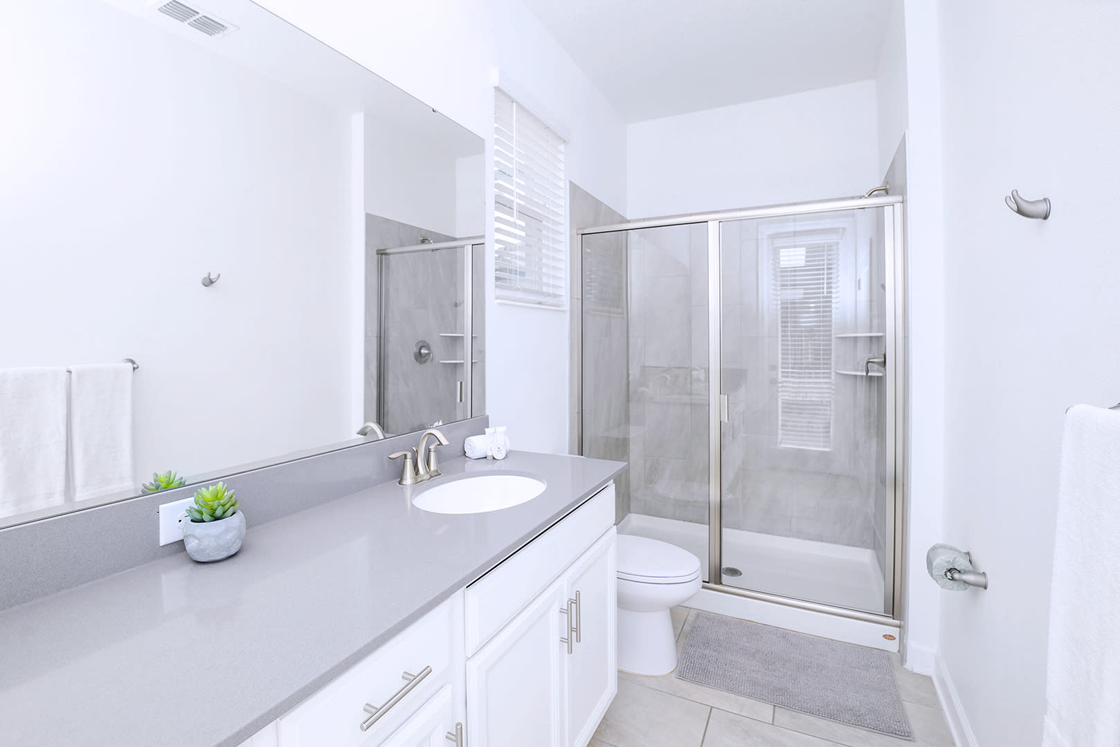 Bright And Modern Bathroom With Sleek Details And Spacious Layout