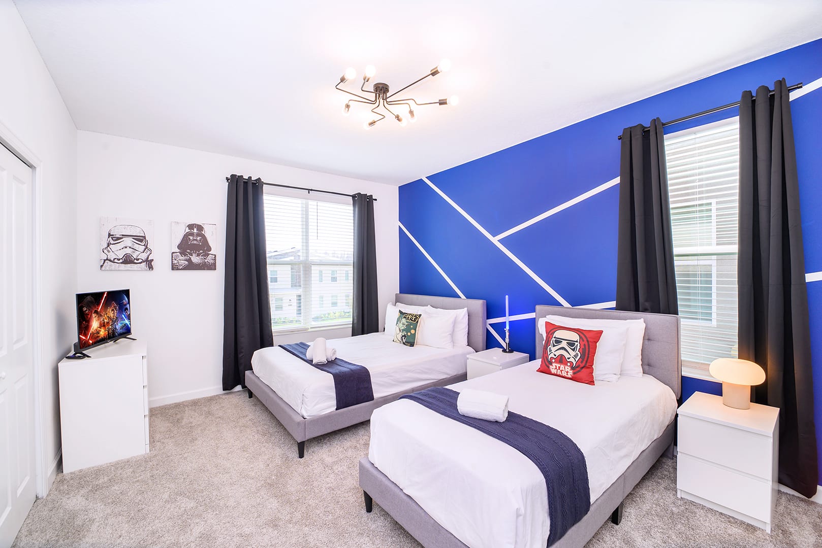 Fun Kid’s Room Featuring Twin Beds And Playful Blue Décor