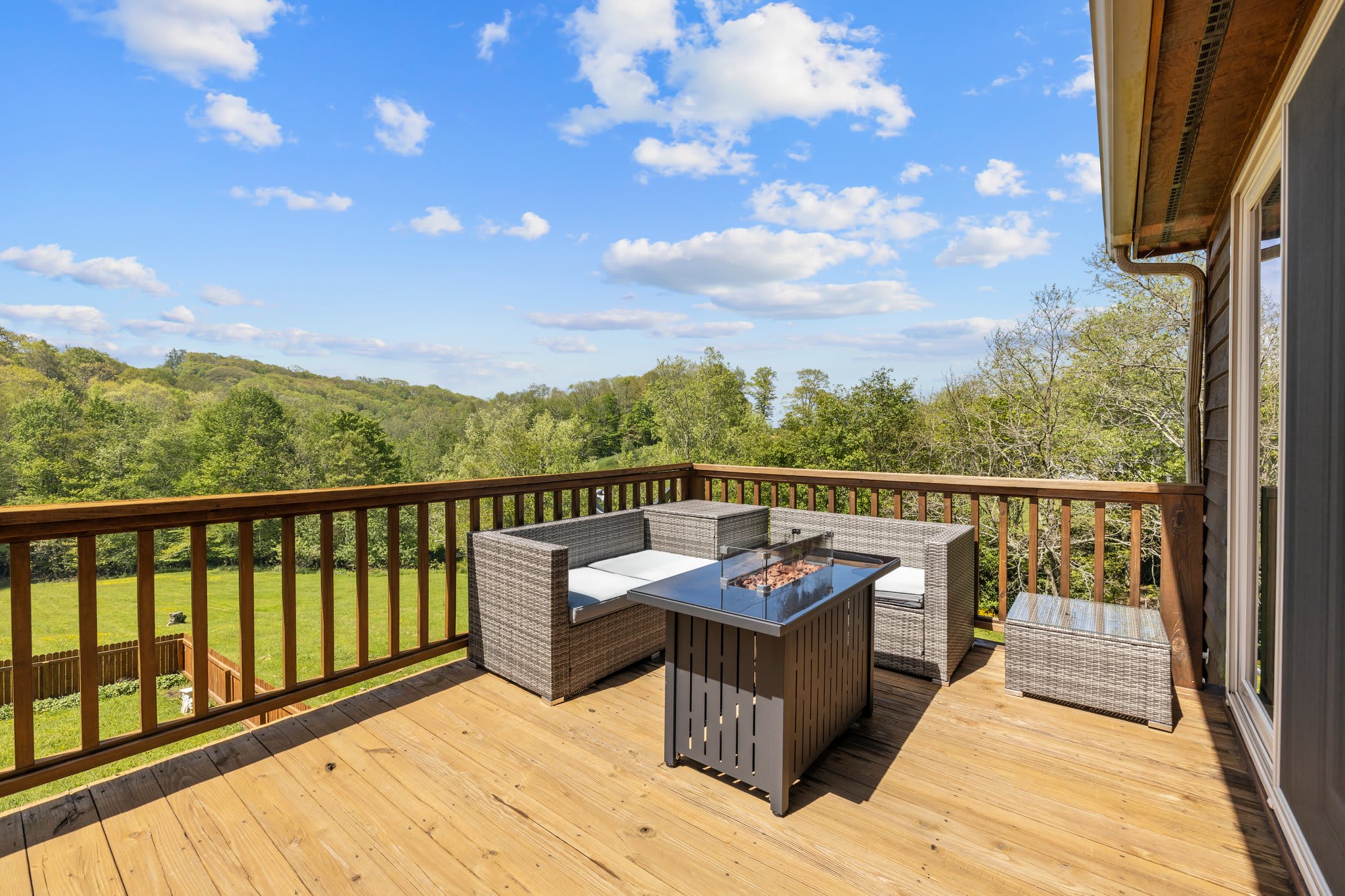 Large deck with a nice view, propane fire table and new outdoor seating