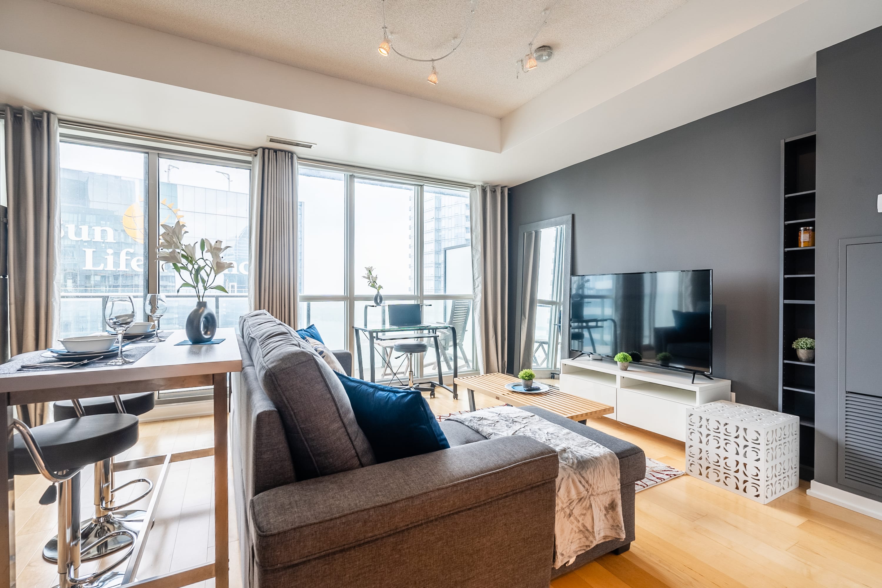 Open Layout Living Area with Smart TV, Direct Balcony Access and Workspace