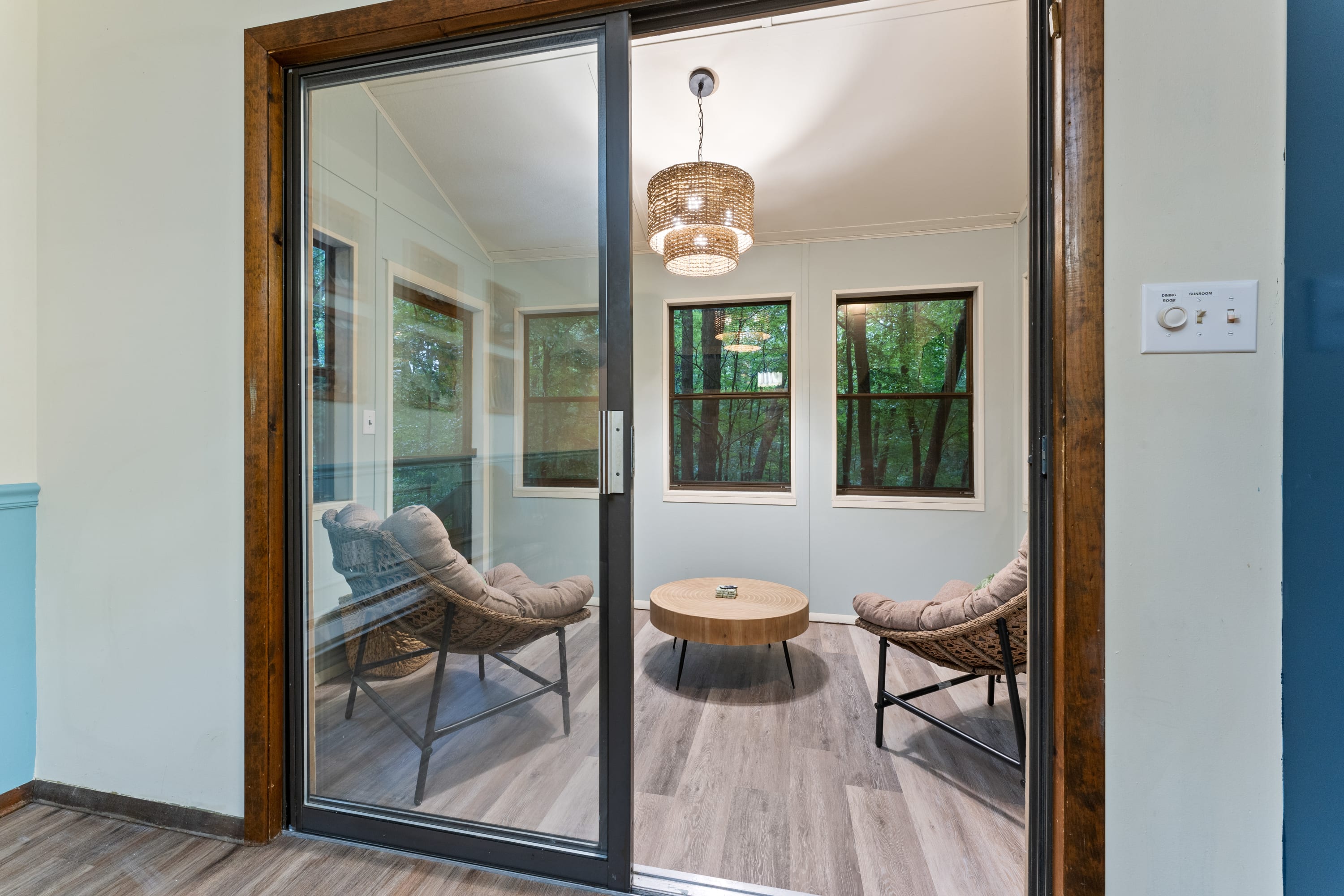 The sunroom is right off of the dining room/kitchen area