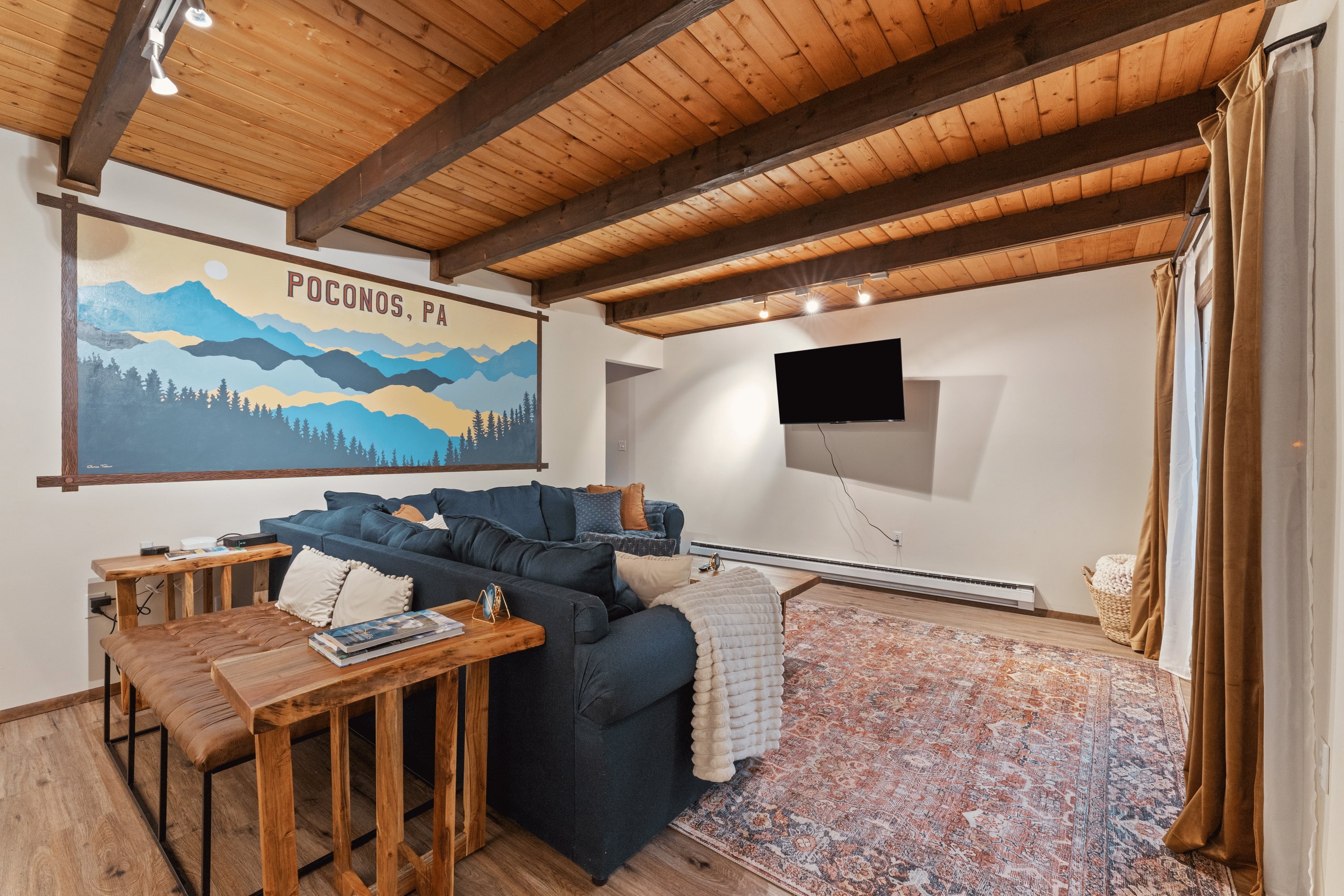 Exposed beams withthe tongue and groove boards really help make this space what it is.