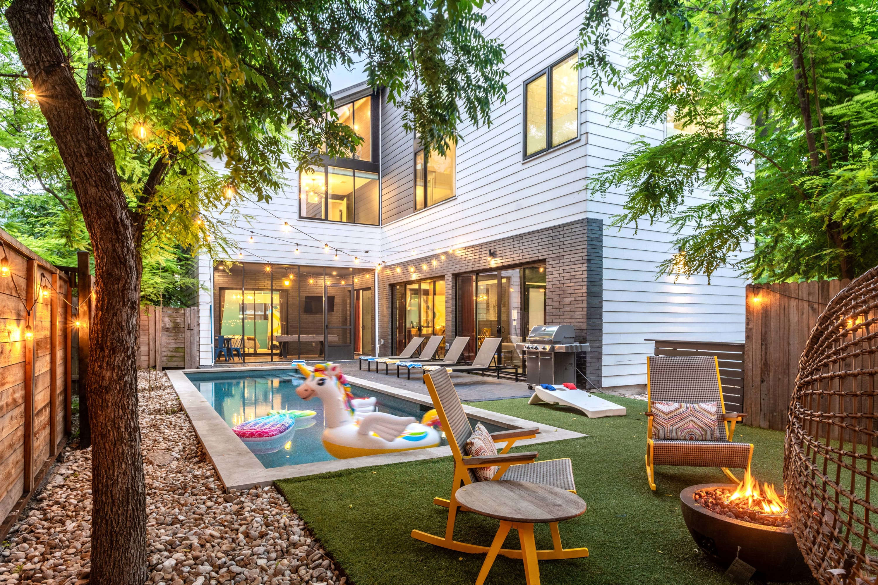 Backyard Oasis With Pool, Fire Pit, And Cozy Lounge Area