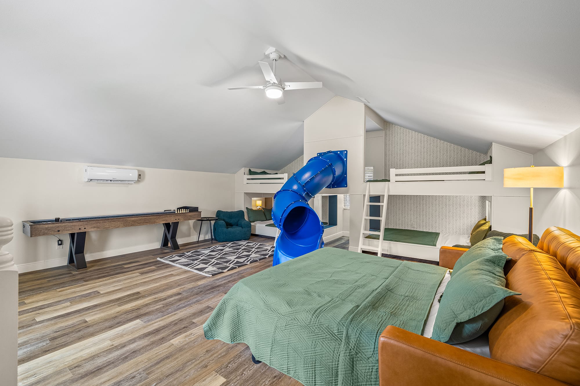 Bunk Room with Four Queen Beds, an additional Queen Pull out couch & shuffleboard- perfect for families!