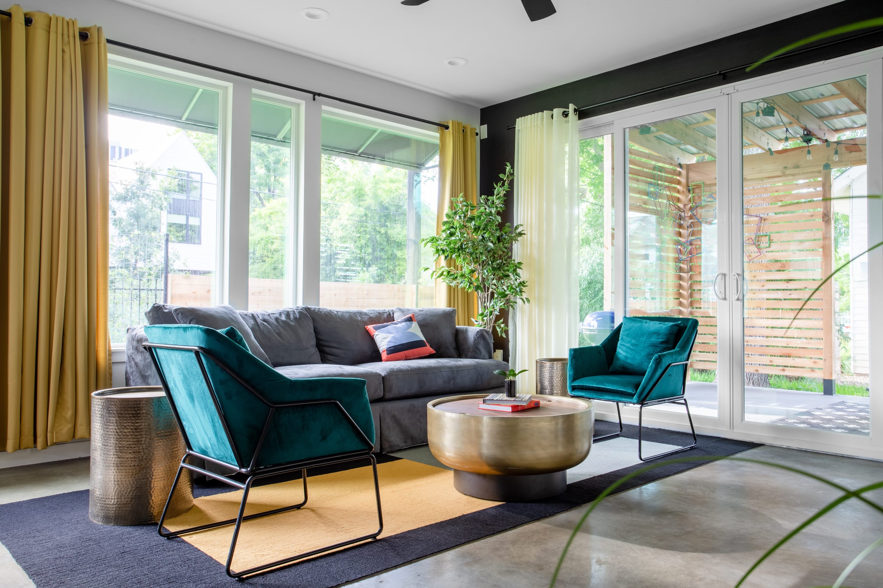 Spacious Living Room With Ample Natural Light and Garden-Facing Windows