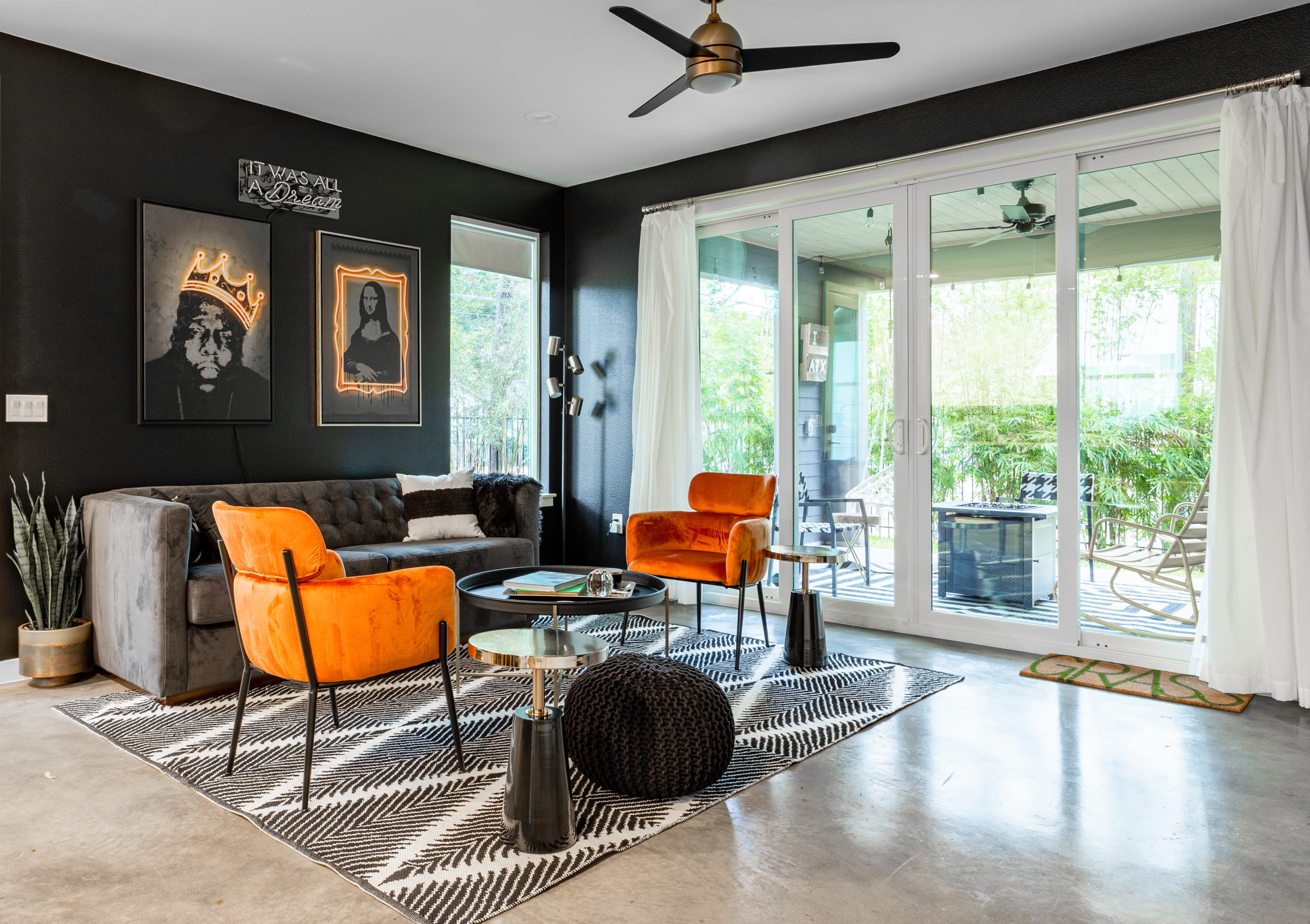 Spacious Living Room with Large Windows and Patio Access