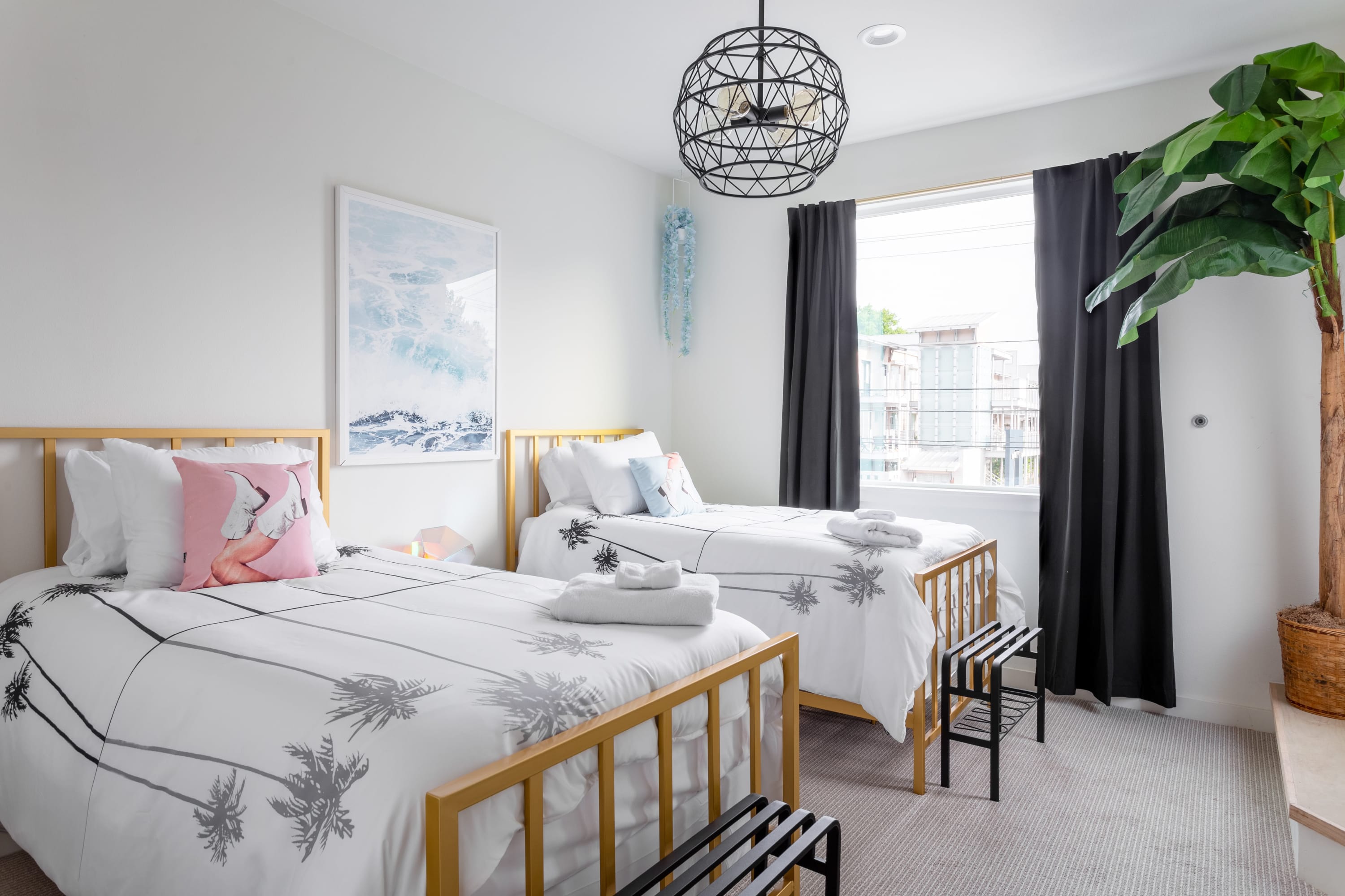 Bright Bedroom With Two Twin Beds, Large Window, And Modern Decor