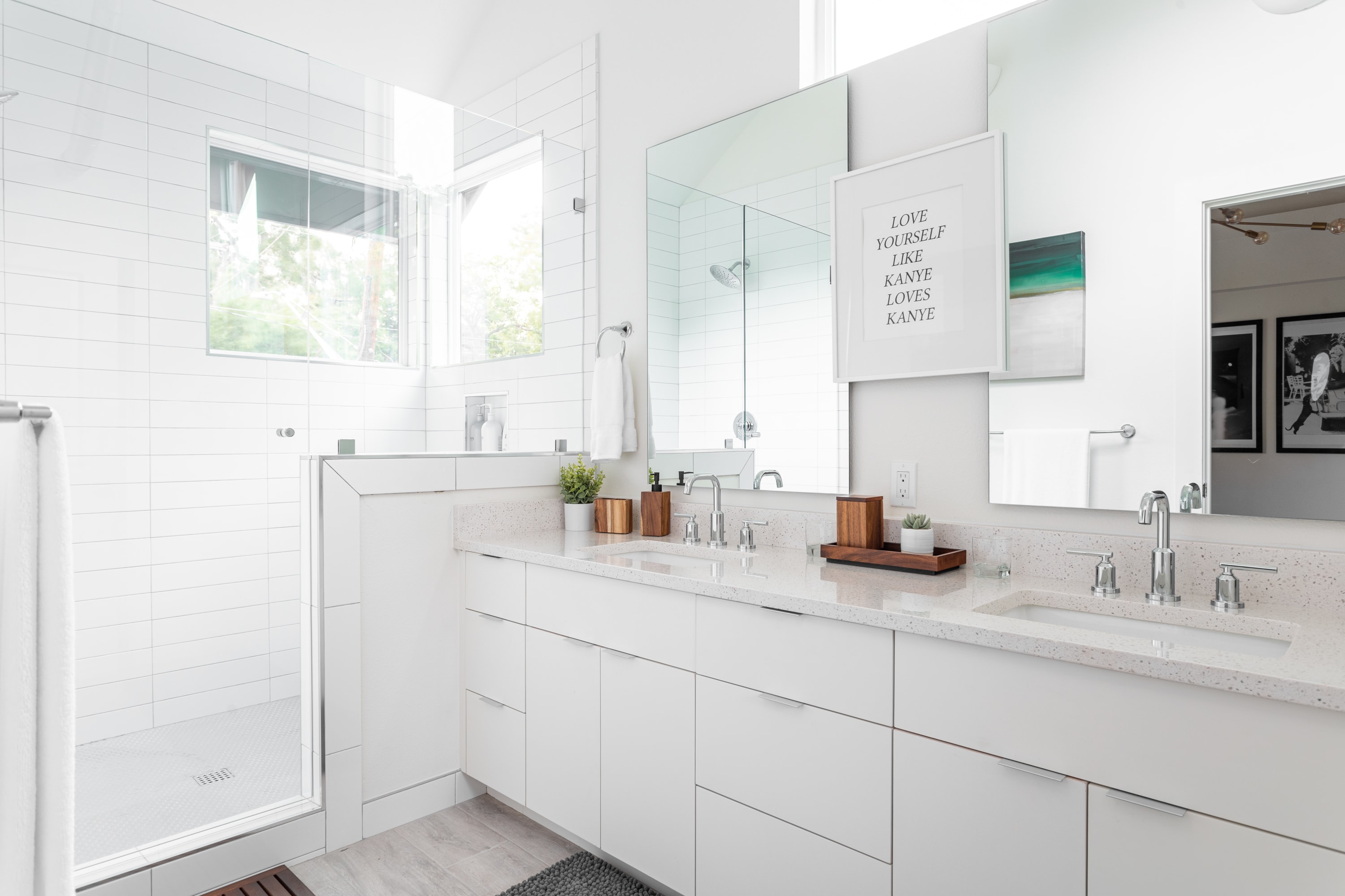 Modern Bathroom With Double Sink And a Spacious Walk-In Shower