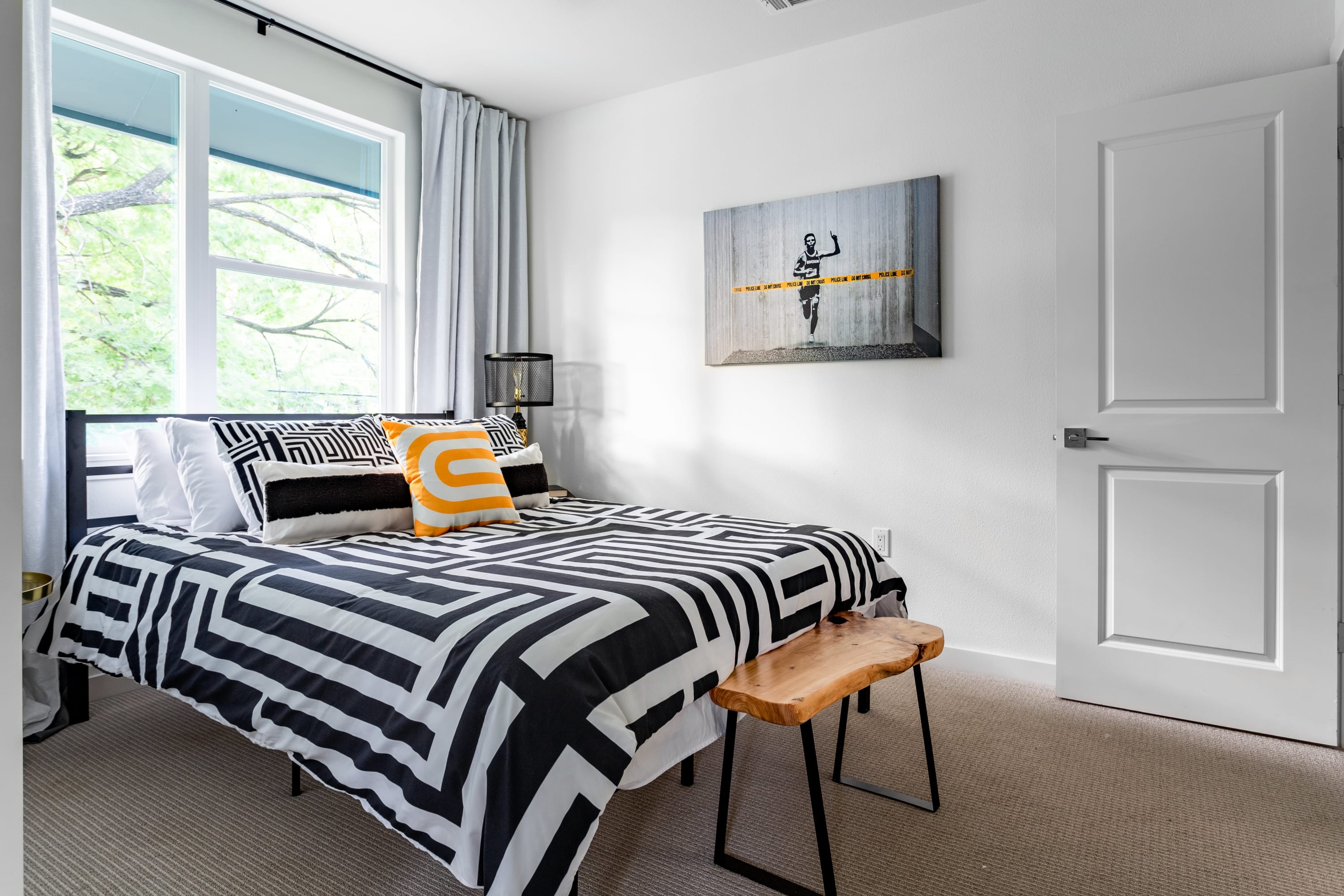 Bright Room With Queen Bed And Stylish Decor