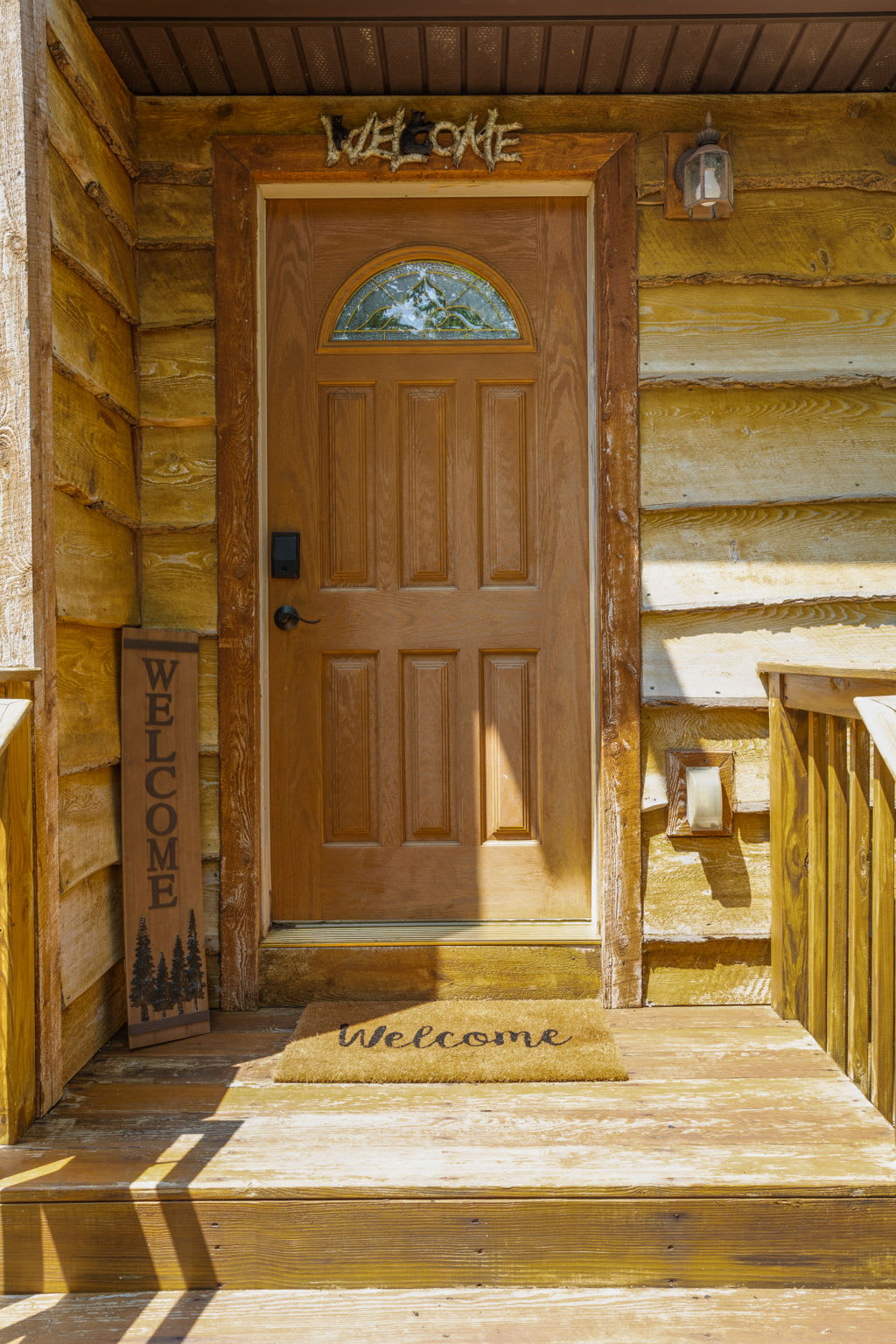 The perfect first impression! A wooden door with charming decor sets the tone for a warm and inviting stay.