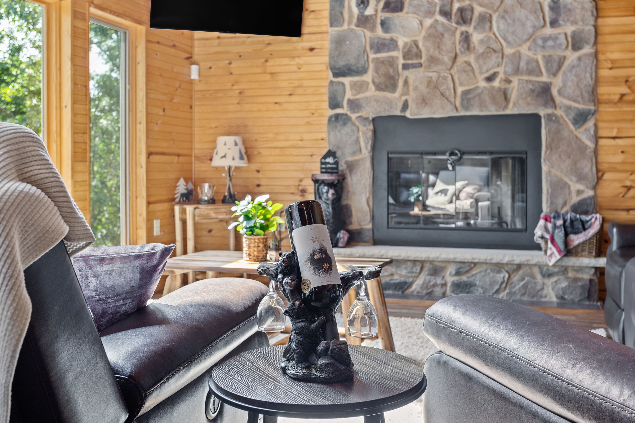 A closer look at the beautifully crafted stone fireplace, where cozy evenings and crackling fires set the mood for relaxation.