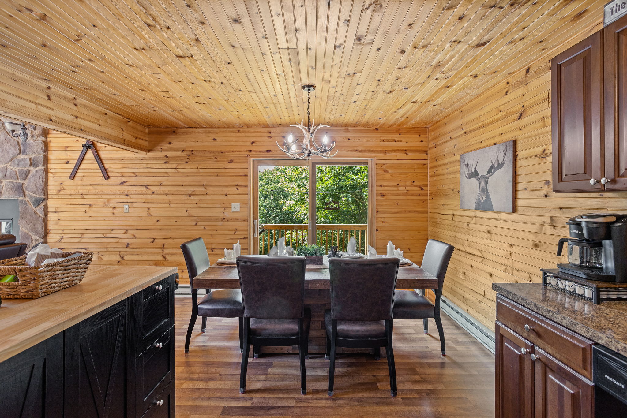 Dining with a View, enjoy meals in this warm, inviting dining space with natural wood finishes and large windows that bring in plenty of natural light.