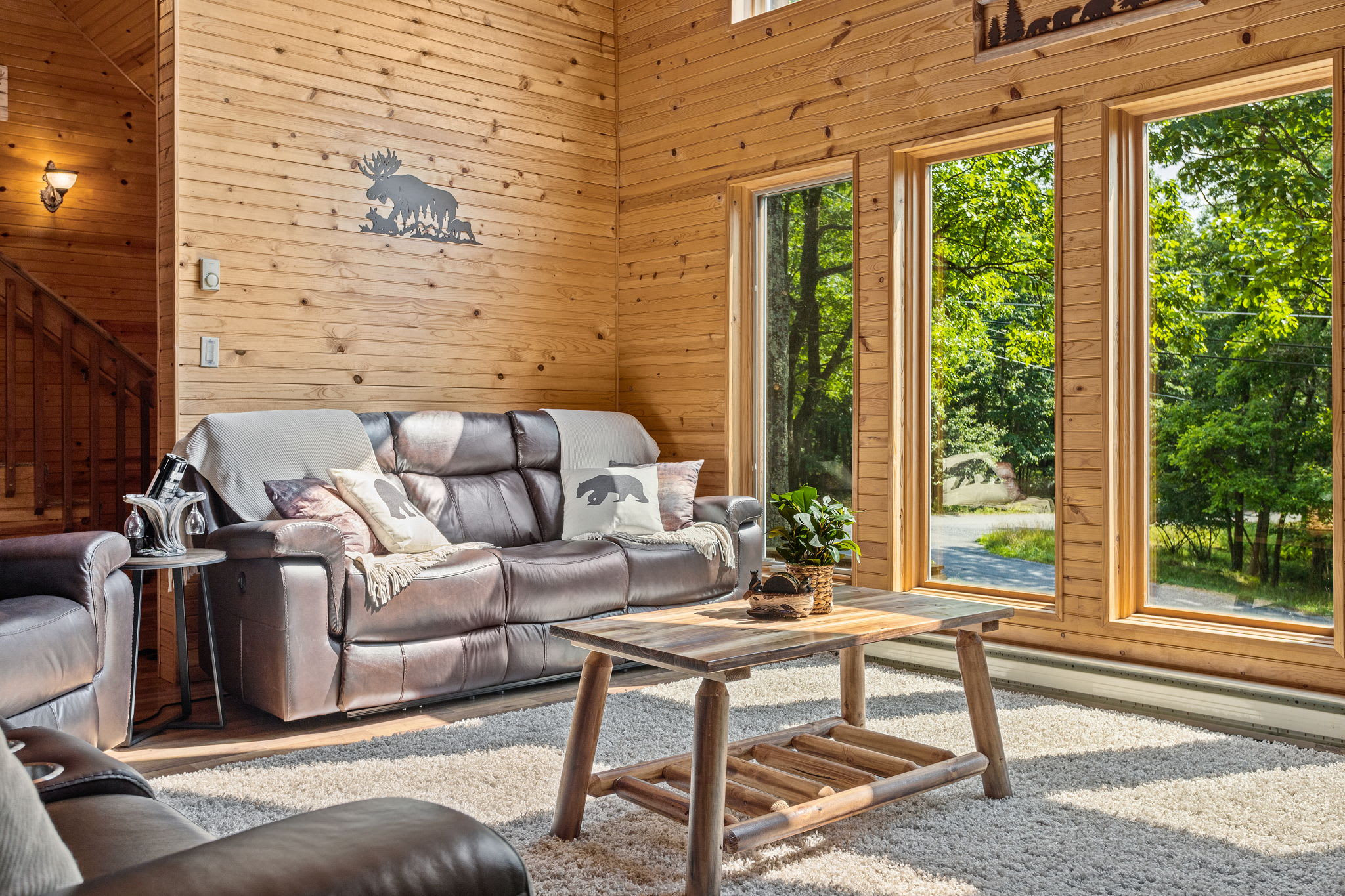 This warm and inviting seating area offers a front-row seat to nature. Whether curling up with a book or enjoying the morning sun, this space is pure comfort.