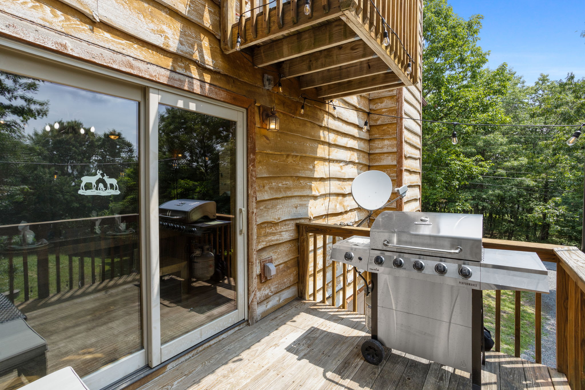 Outdoor BBQ Ready for Grilling, fire up the grill on this private deck and enjoy al fresco dining with a view of the surrounding trees.