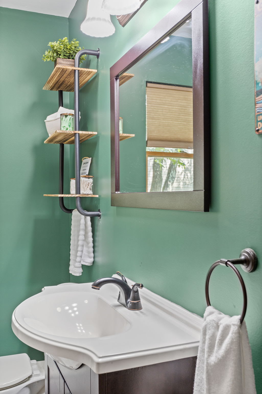 Thoughtfully designed with stylish shelving and natural accents, this vanity space combines function and charm for a refreshing start to your day.