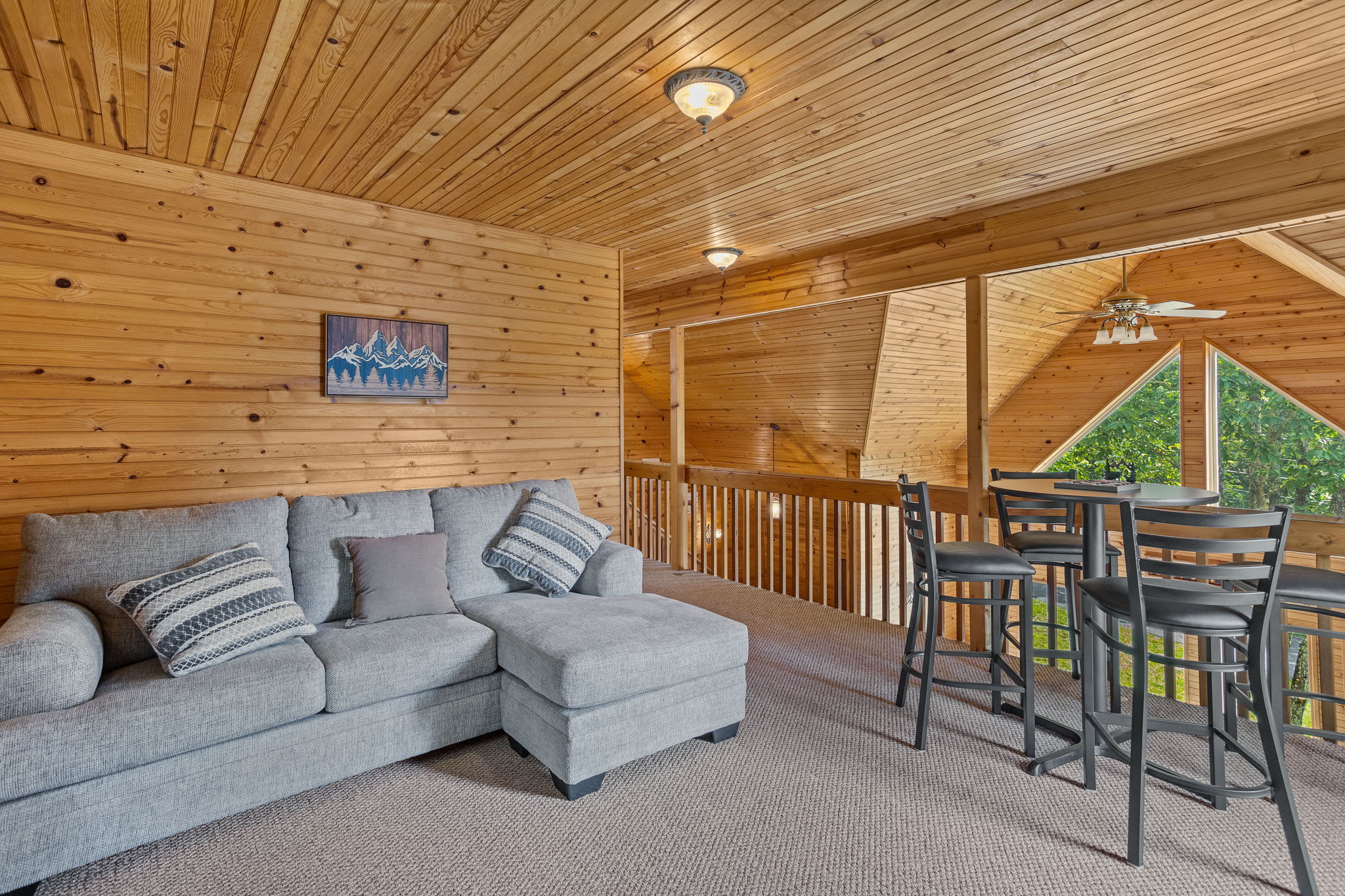 Kick back in this inviting loft space, complete with a plush sectional and a table for games or casual dining.