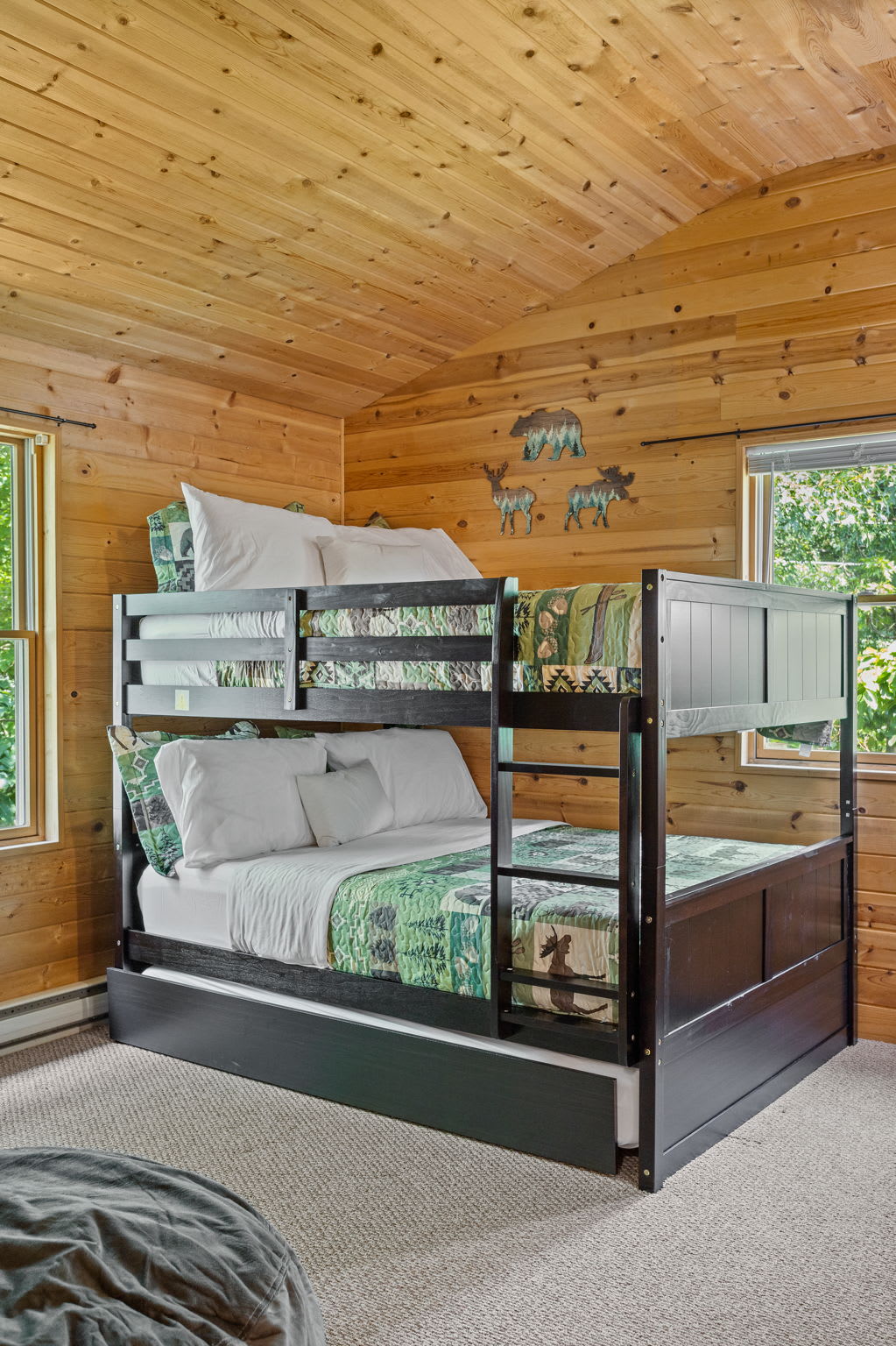 A closer look at the stylish and comfortable bunk beds, offering a great space for kids or friends to relax after a day of adventure.