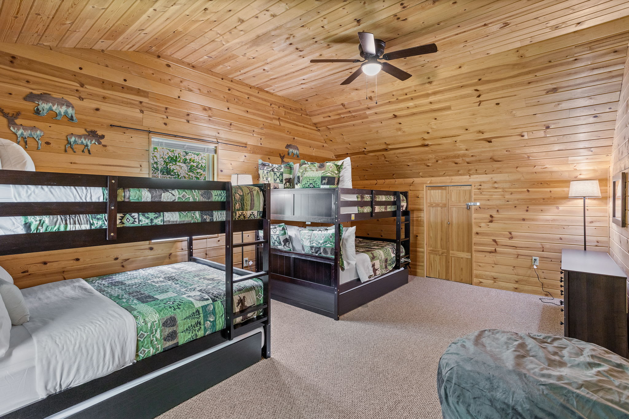 The spacious layout, soft carpeting, and cozy bunk beds make this the perfect retreat for both kids and adults.