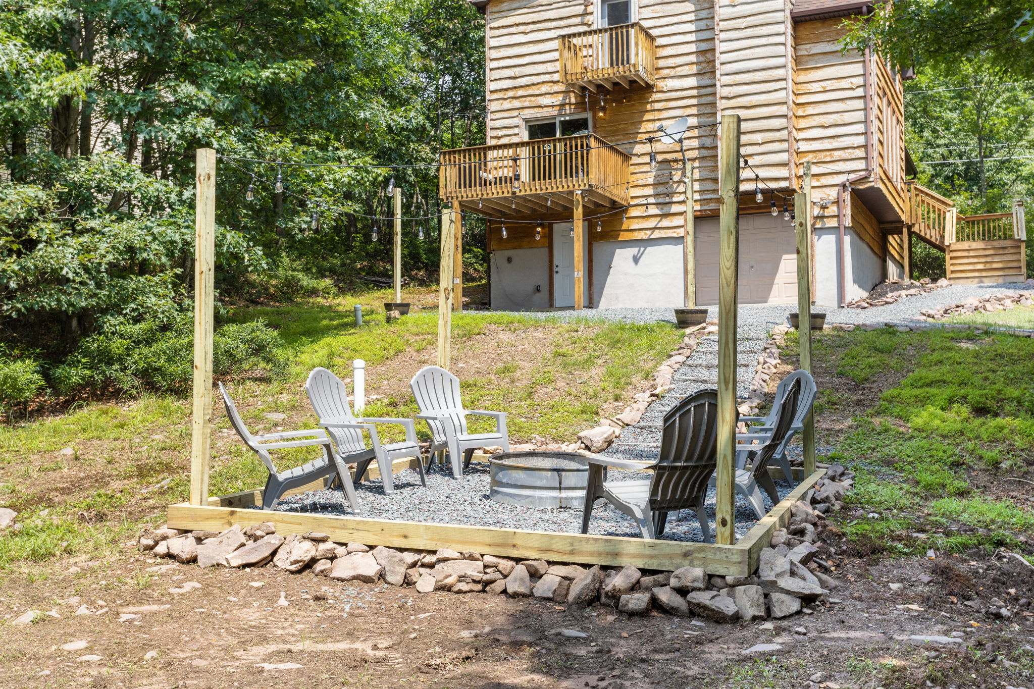 This well-crafted fire pit setup offers a scenic escape, blending seamlessly with the natural surroundings.