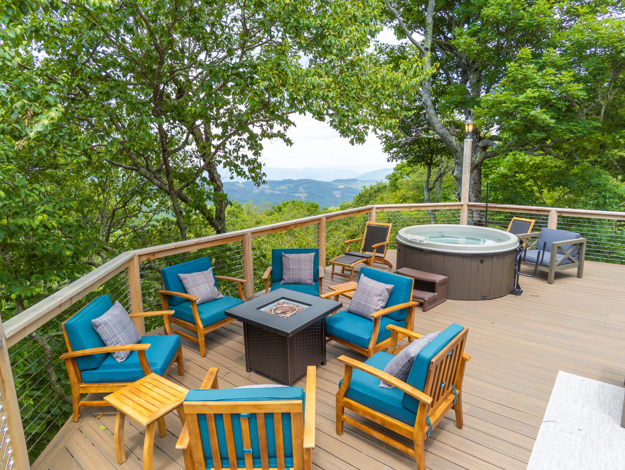 Welcome to our Beech Mountain Cabin! While there's 3 decks in total (including a Private deck off of the Master bedroom), this one is our favorite. It's where you and your friends and family will soak in the woods and some pretty awesome mountain views. W