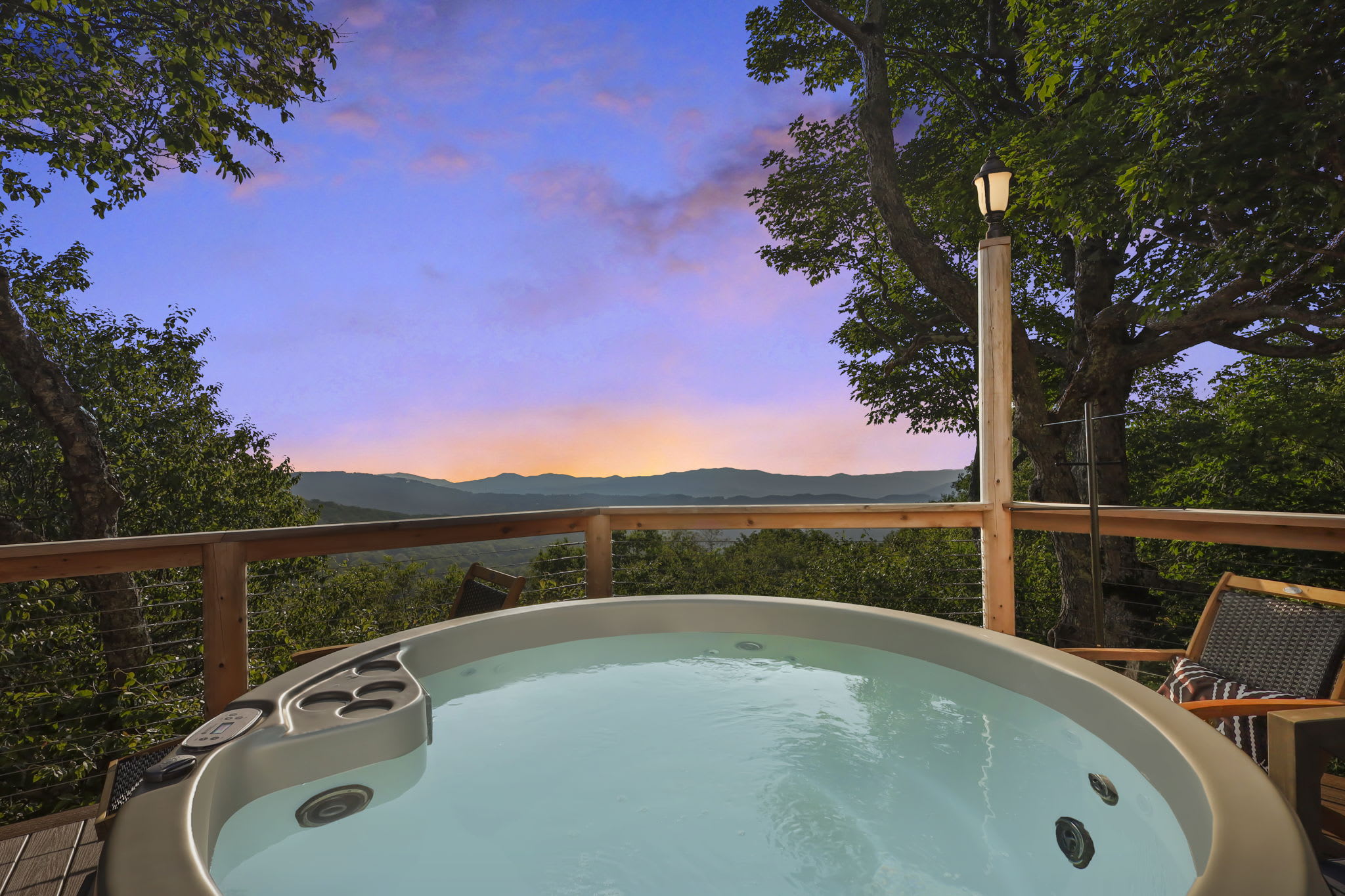 Sit in the hot tub and relax- soak up these mountain views on the front deck with a fire pit, BBQ, outdoor seating, loungers, & more!