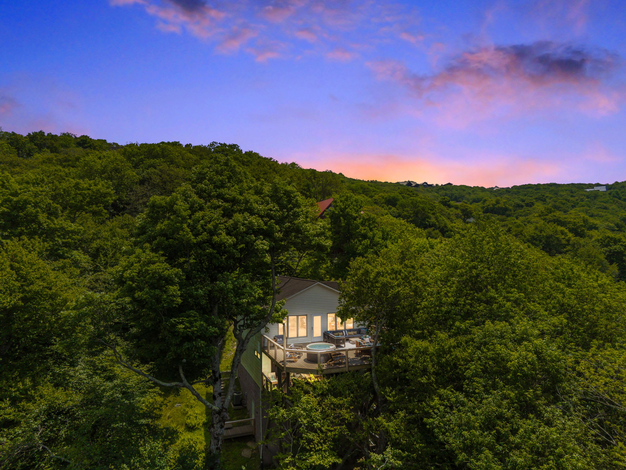 Our cabin is nestled in the mountains with miles of mountain views!