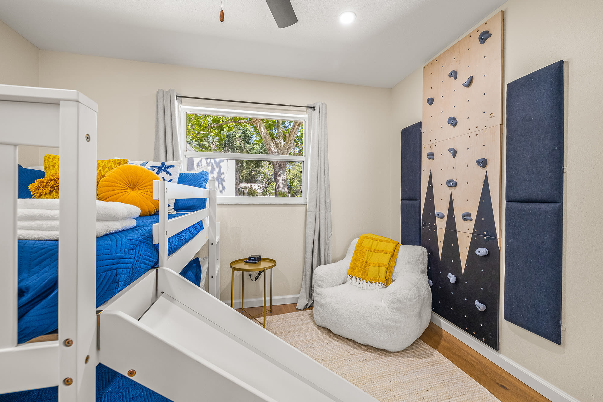 Welcome to the bunk room- this room is a kid's dream with 2 full beds (sleeps 4), a rock wall, 2 bean bags, a Smart TV, mirror, and closet