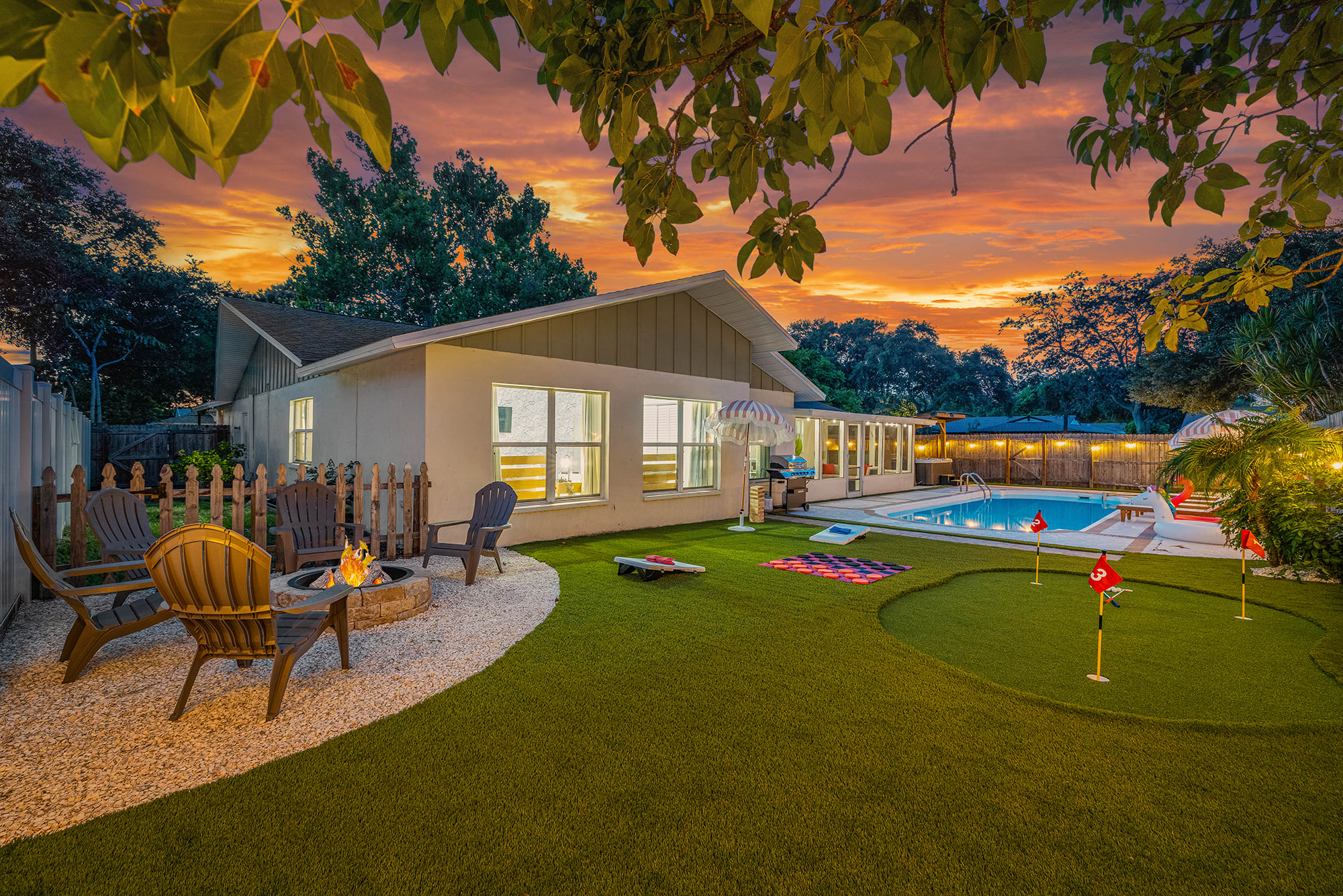 Your paradise backyard- fully stocked with a ton of amenities- professionally installed putt putt course, fire pit, corn hole, checkers, pool, and a brand new hot tub!