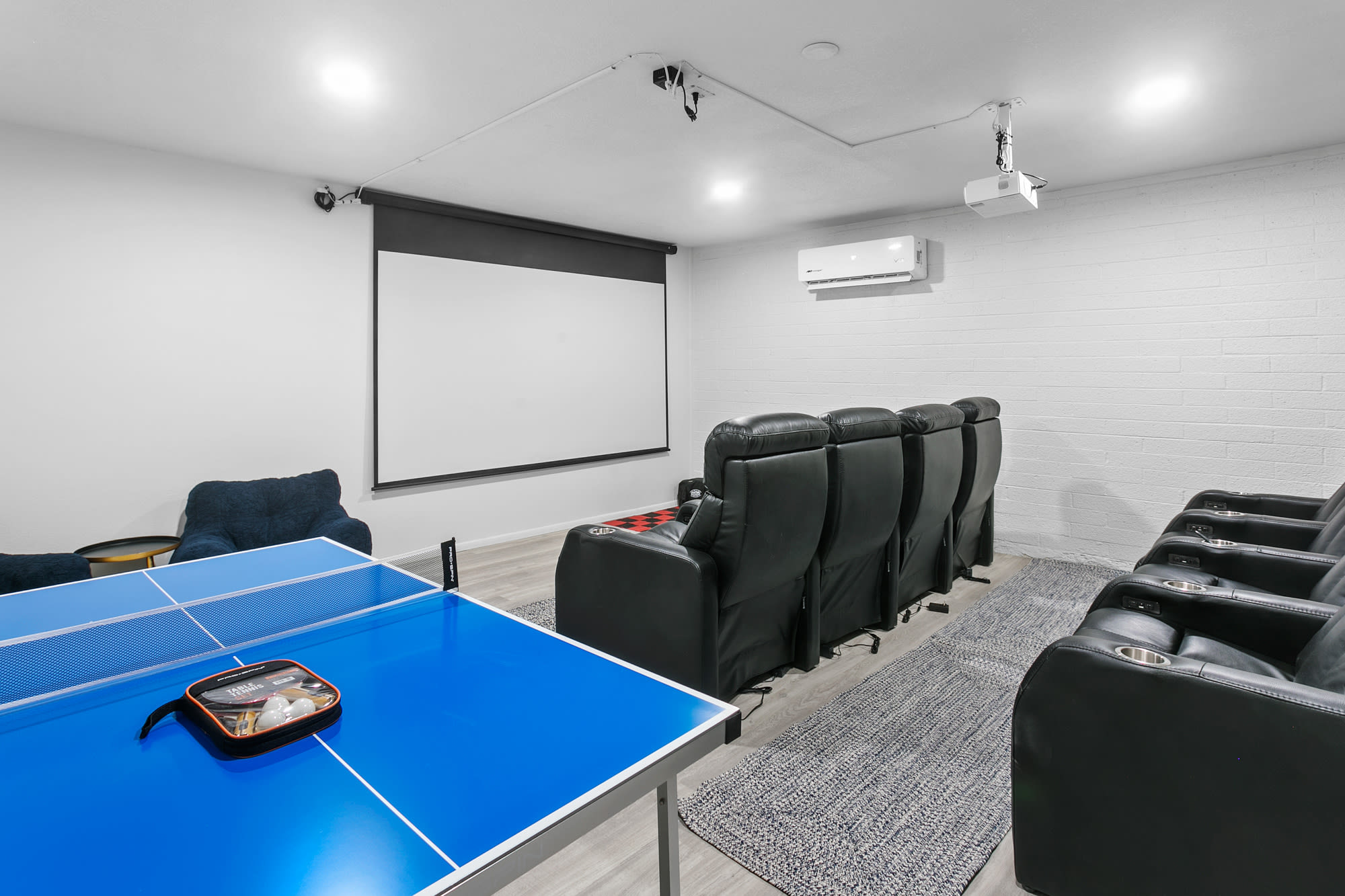 We built this awesome Movie Theatre with seating for 10... Plus ping pong!