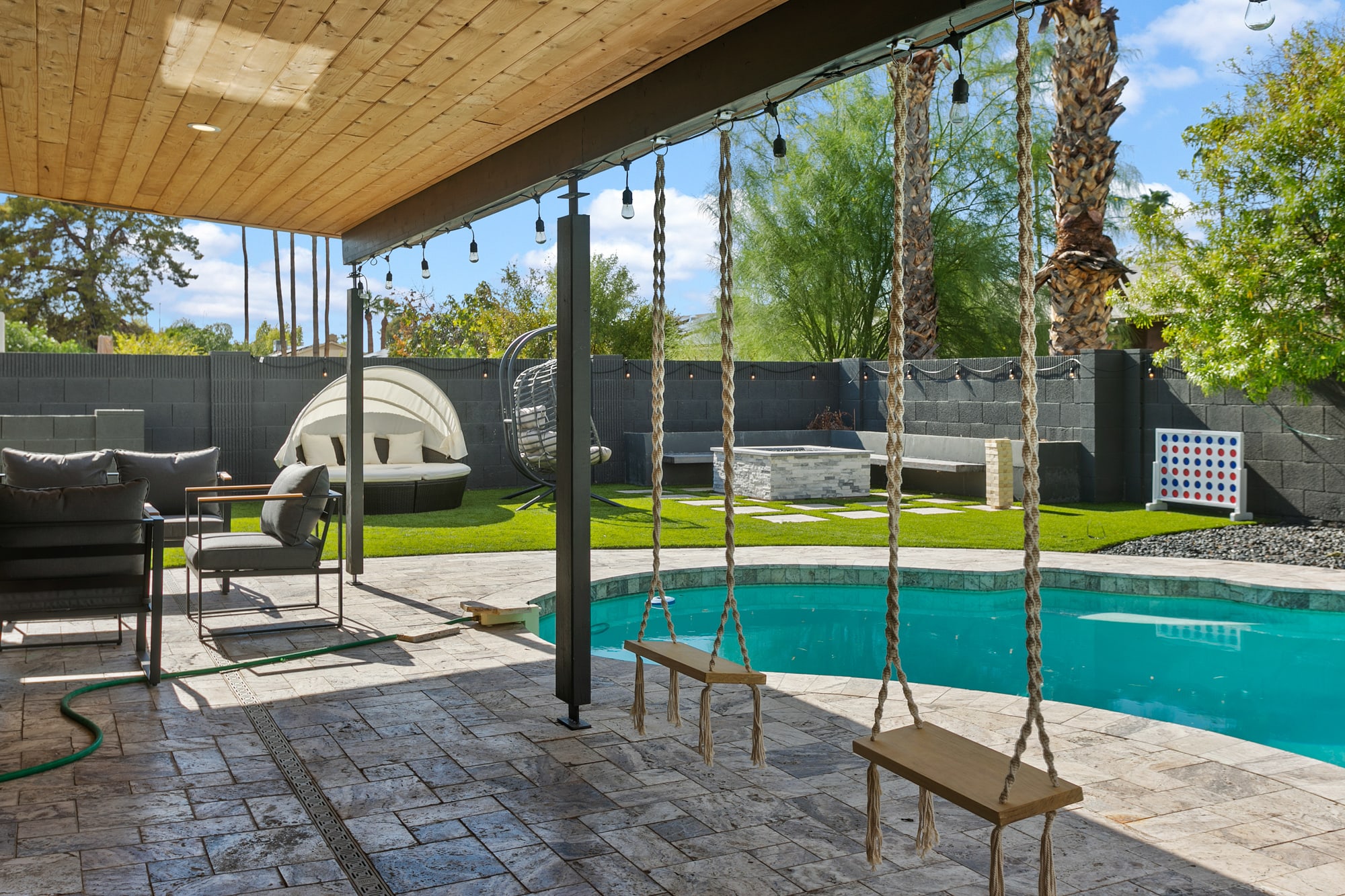 Sit on a swing by the heated pool!